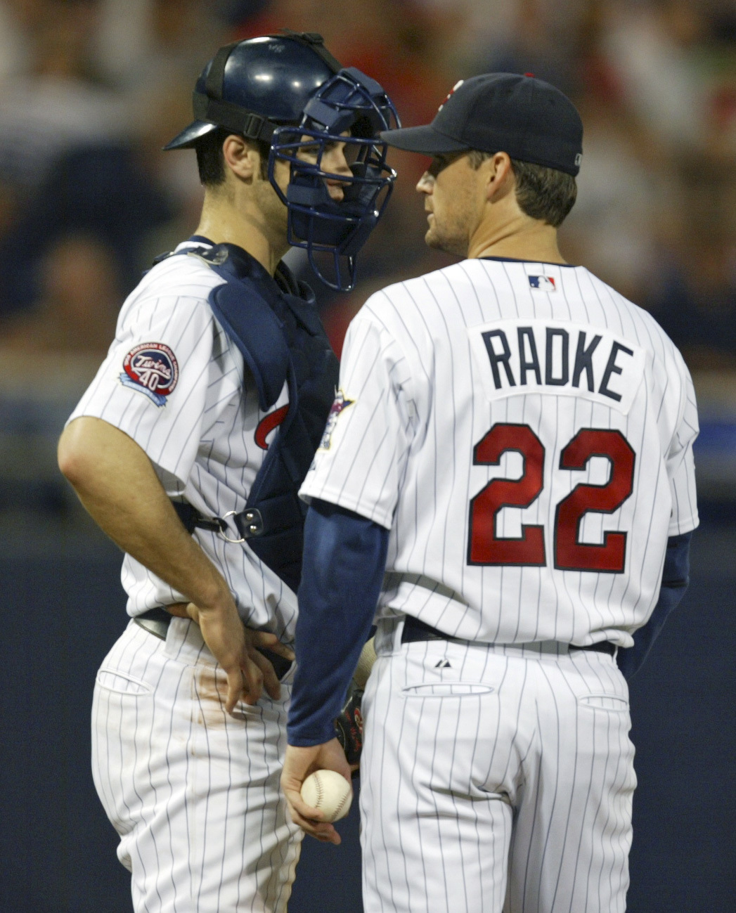 Bruce Bisping/Star Tribune. Minneapolis, MN., Wednesday, 6/29/2005. Minnesota Twins vs. KC Royals. (left to right) Twins catcher Joe Mauer and pitcher Brad Radke talked on the mound during the 4th inning. Radke gave up two runs in the 1st inning and o