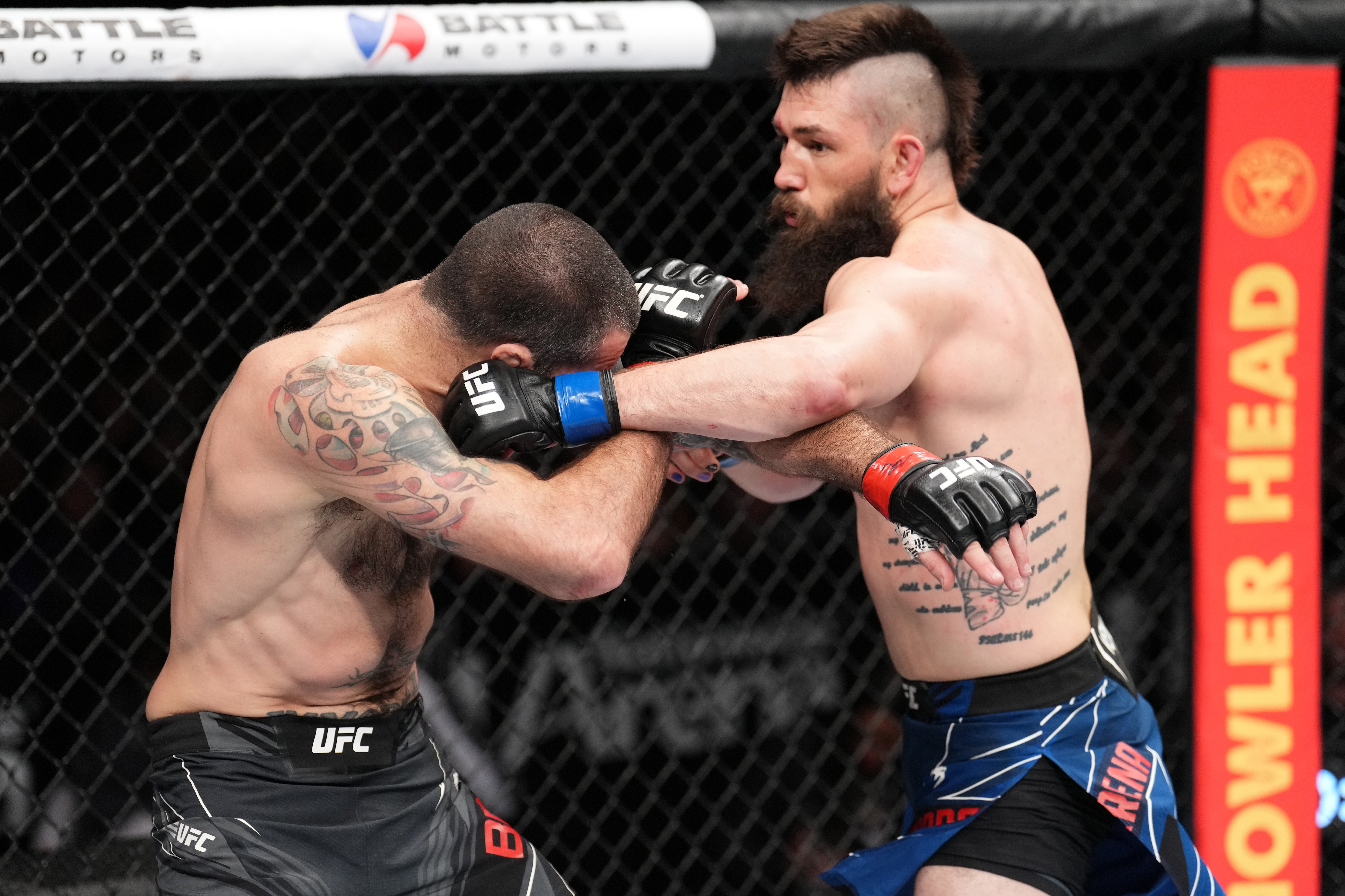Bryan Barberena punches Matt Brown in an epic welterweight fight at UFC Columbus.