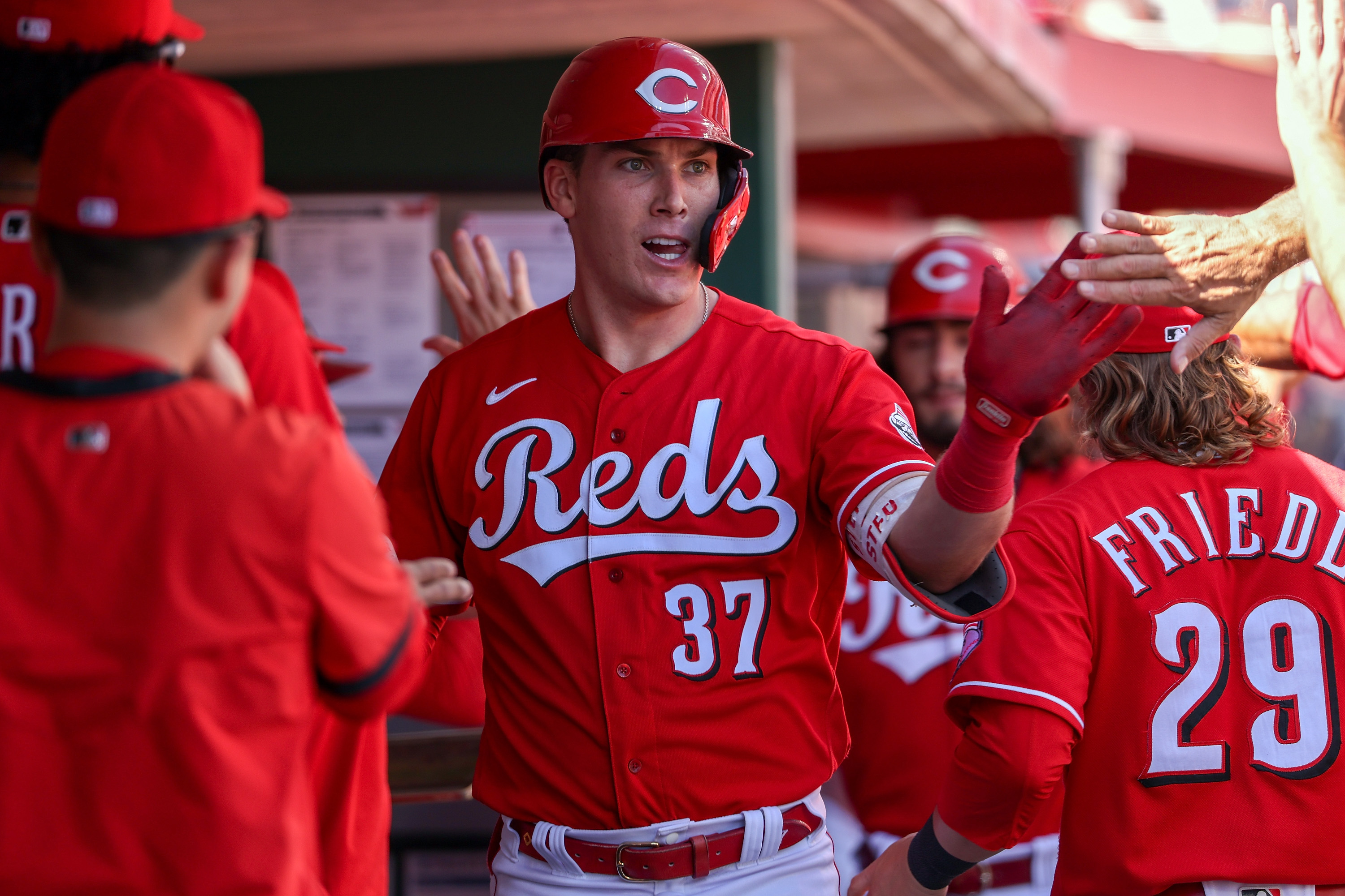 Tyler Stephenson #37 of the Cincinnati Reds celebrates with teammates after hitting a home run in the fifth inning against the Washington Nationals at Great American Ball Park on September 26, 2021 in Cincinnati, Ohio.