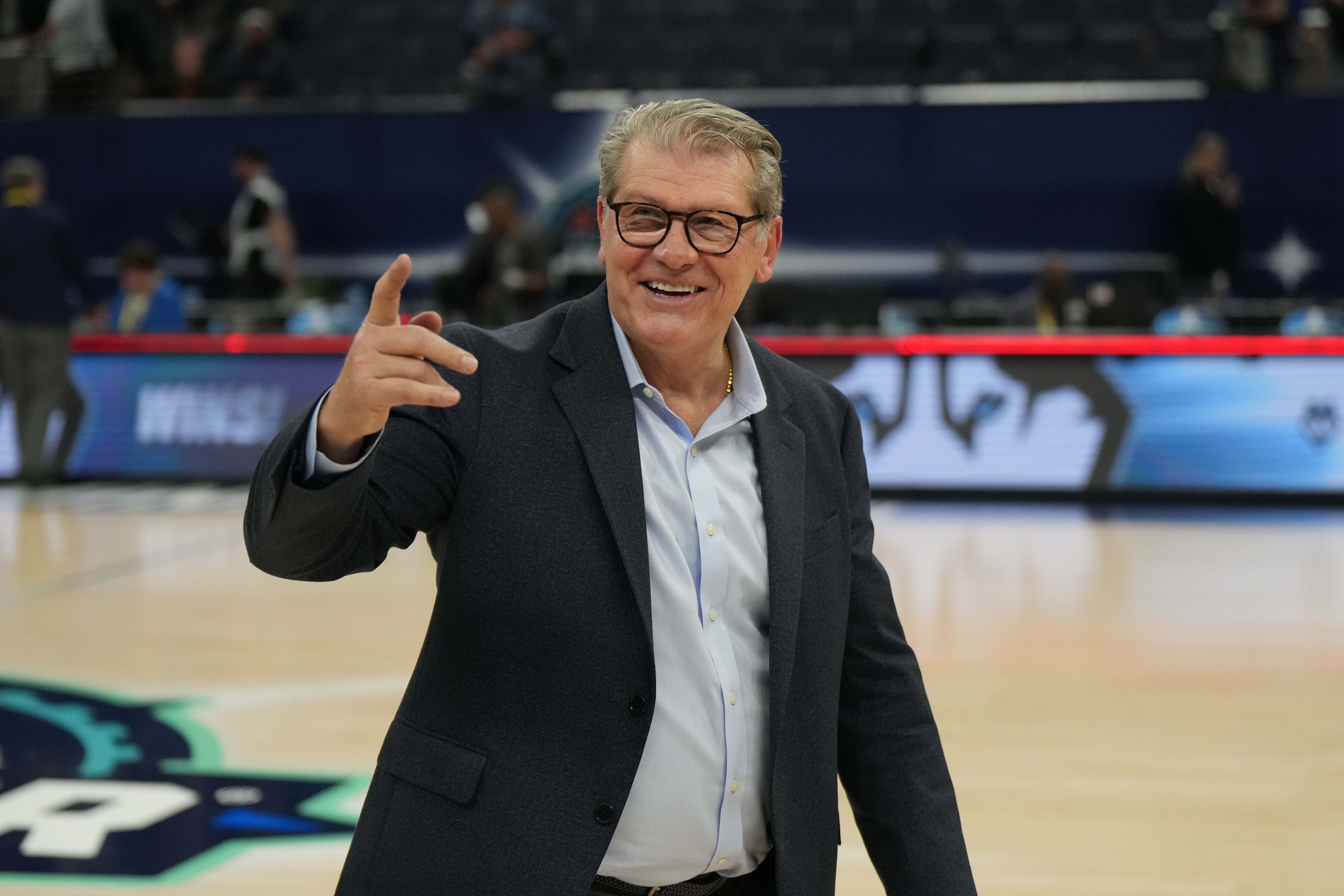 UConn Huskies head coach Geno Auriemma reacts to fans in the stands after defeating the Stanford Cardinal in the Final Four semifinals of the women’s college basketball NCAA Tournament at Target Center.