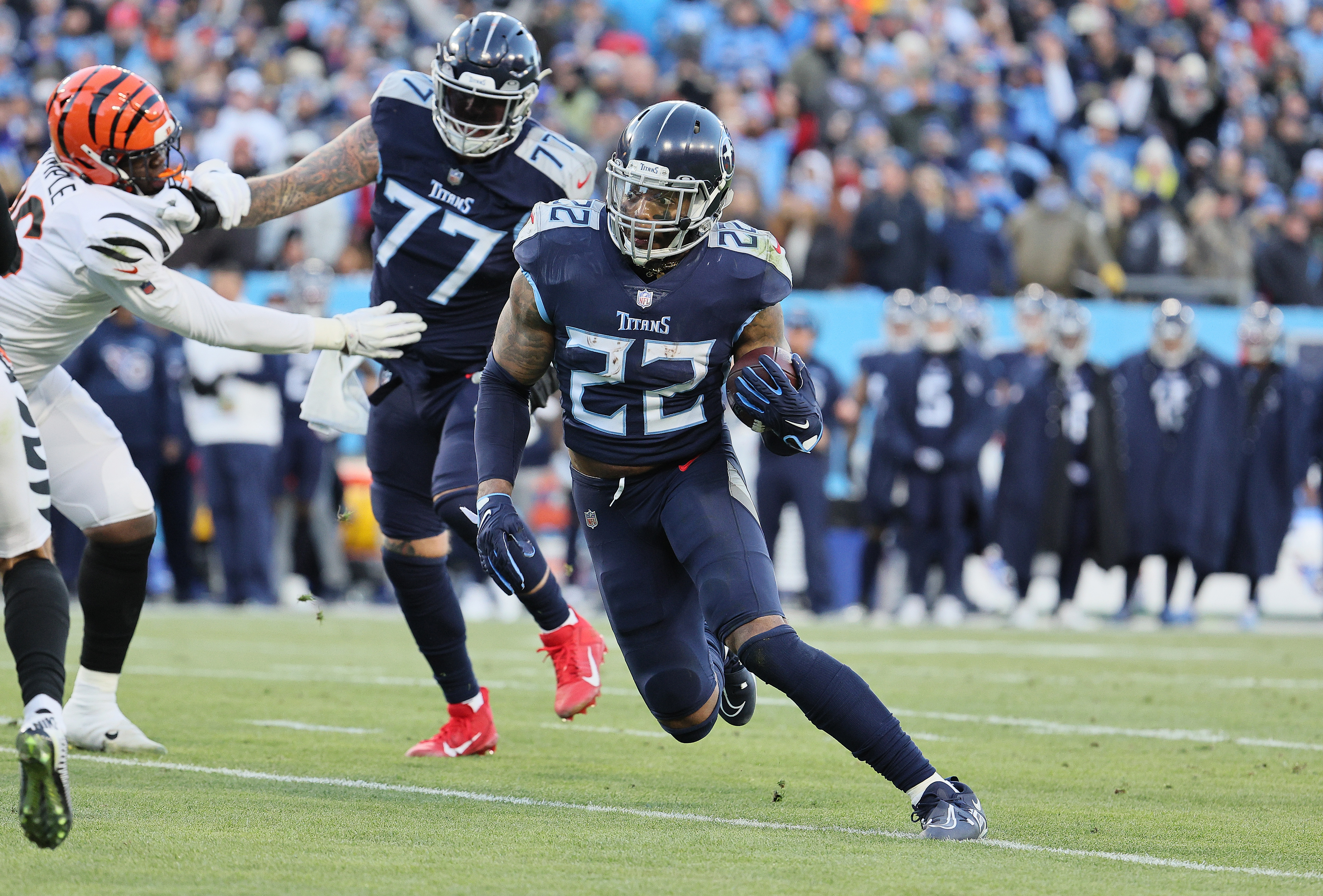 Derrick Henry #22 of the Tennessee Titans runs for a touchdown against the Cincinnati Bengals during the AFC Divisional Playoff at Nissan Stadium on January 22, 2022 in Nashville, Tennessee.