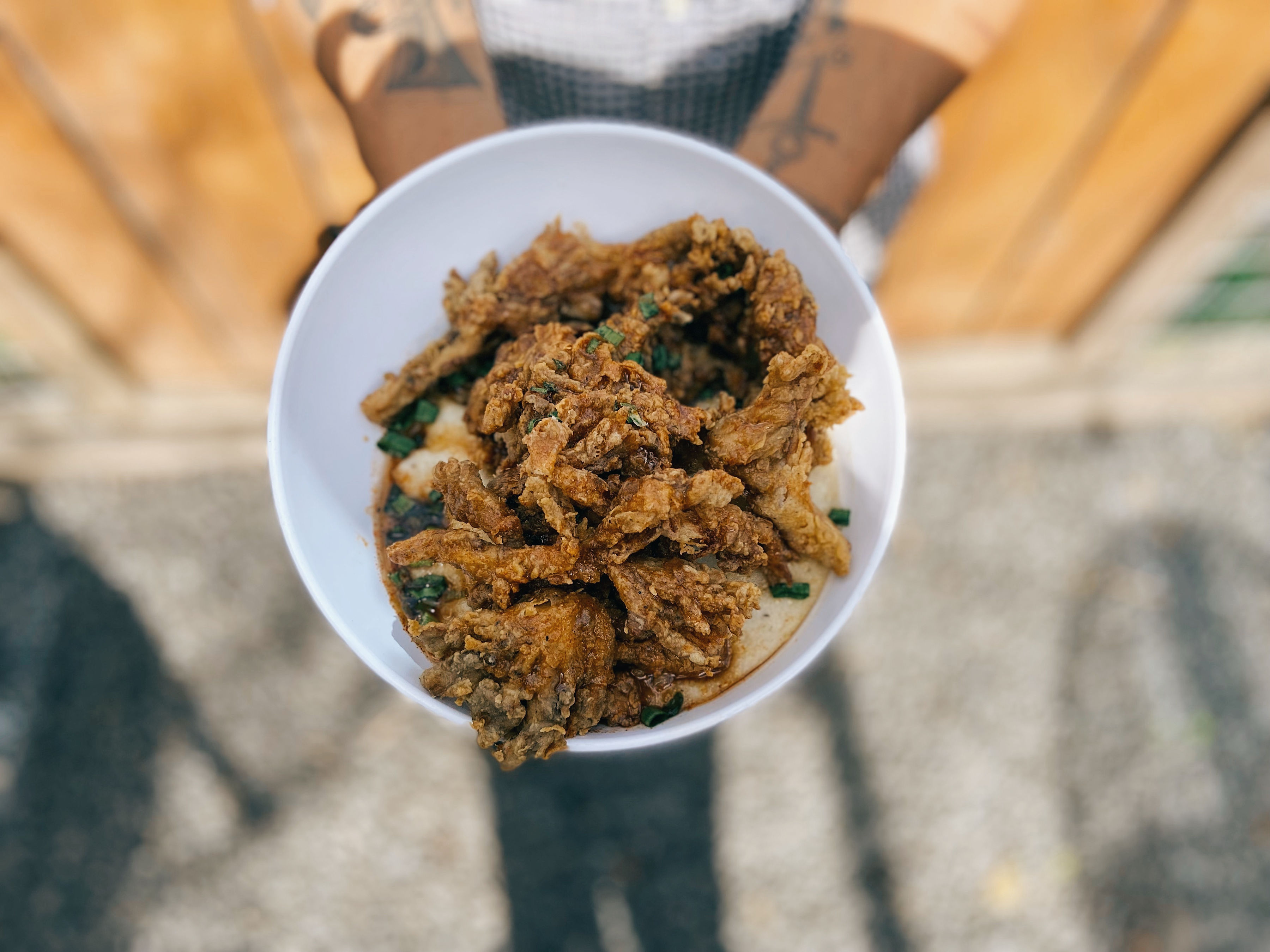 Overhead shot of Mo’ Better Brews’ vegan chik’n fried shrooms over grits.
