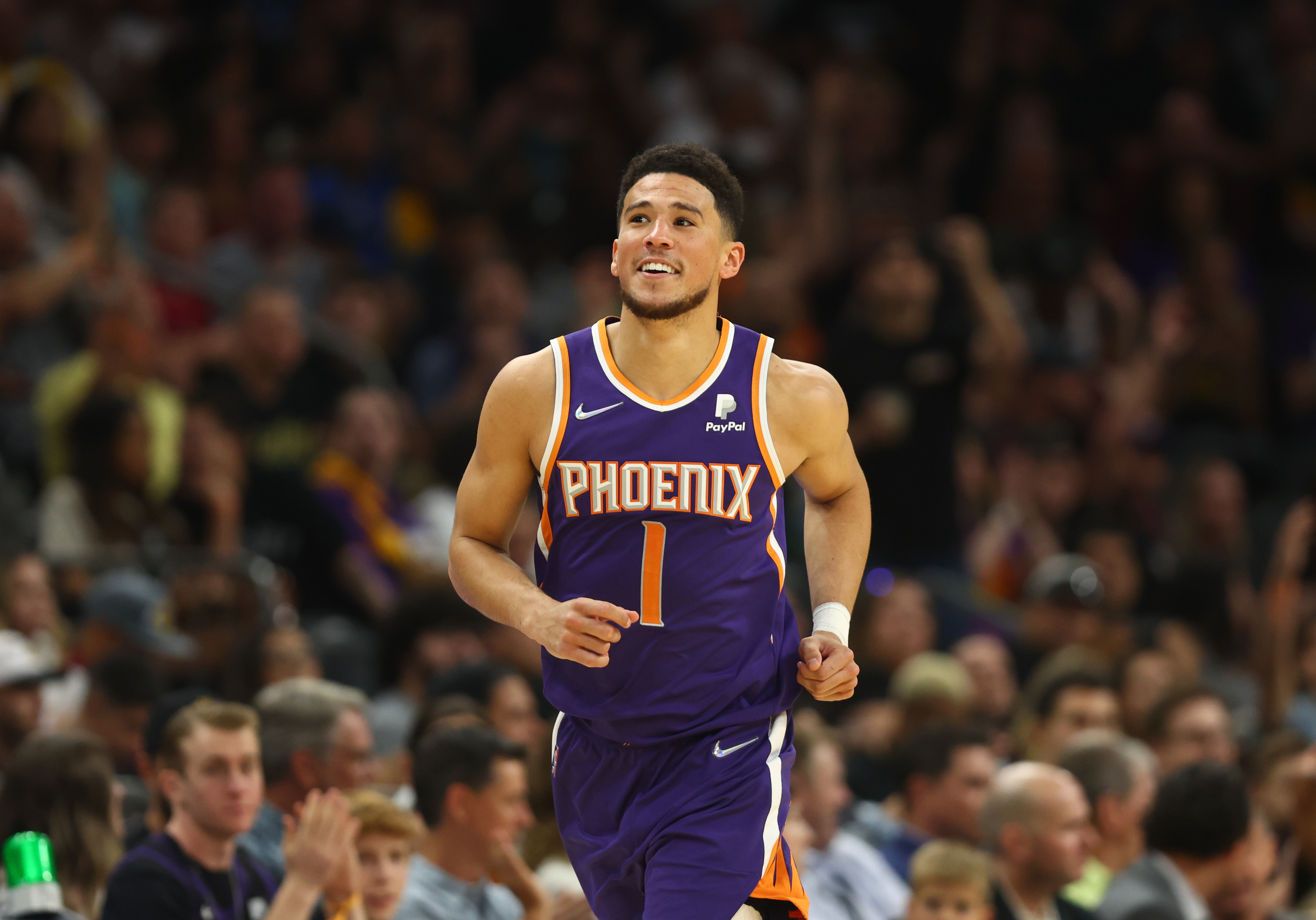 Phoenix Suns guard Devin Booker celebrates in the second half against the Los Angeles Lakers in the second half at Footprint Center.