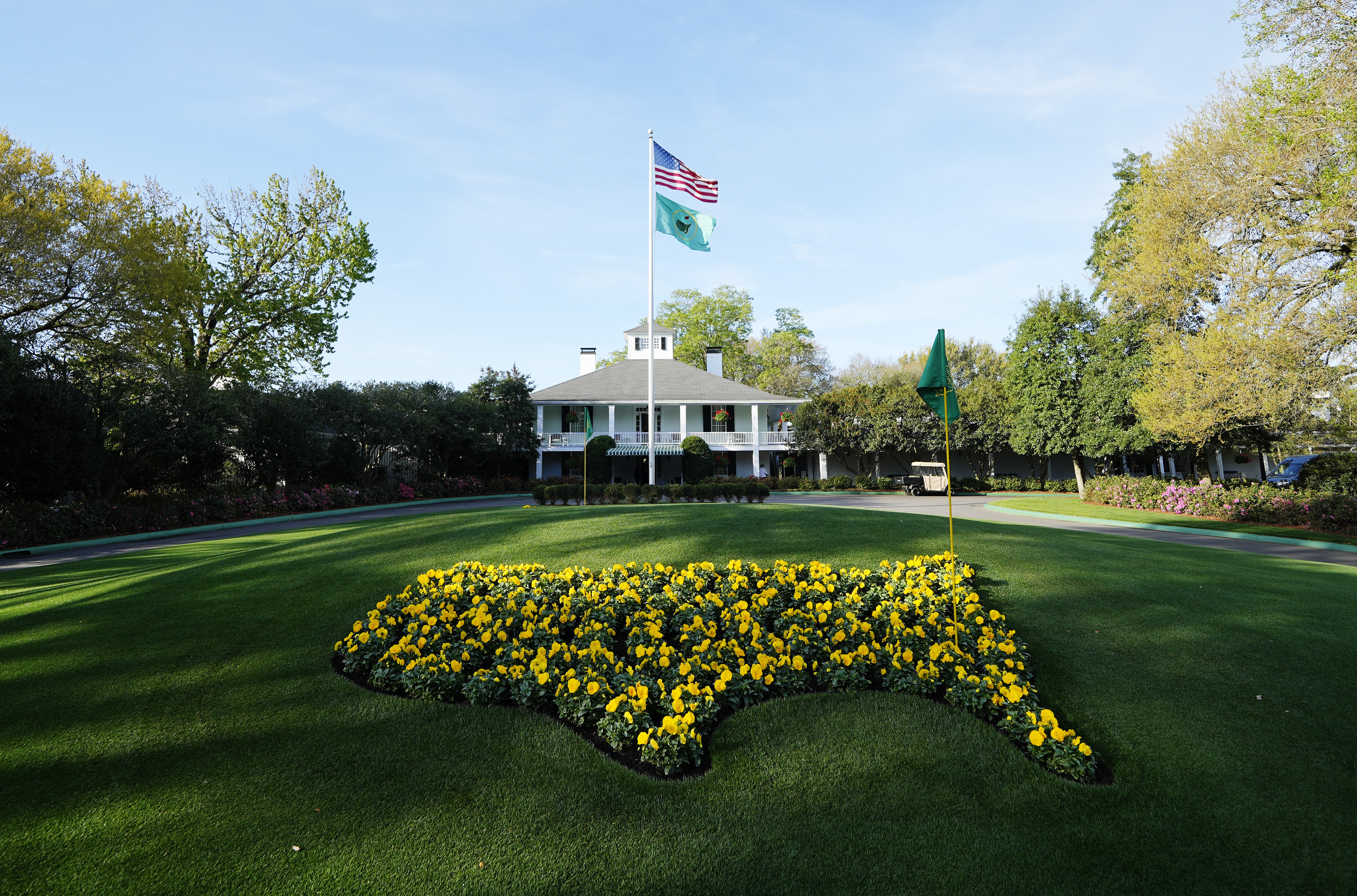 The early morning sun hits the clubhouse during a practice round of The Masters golf tournament at Augusta National Golf Club.
