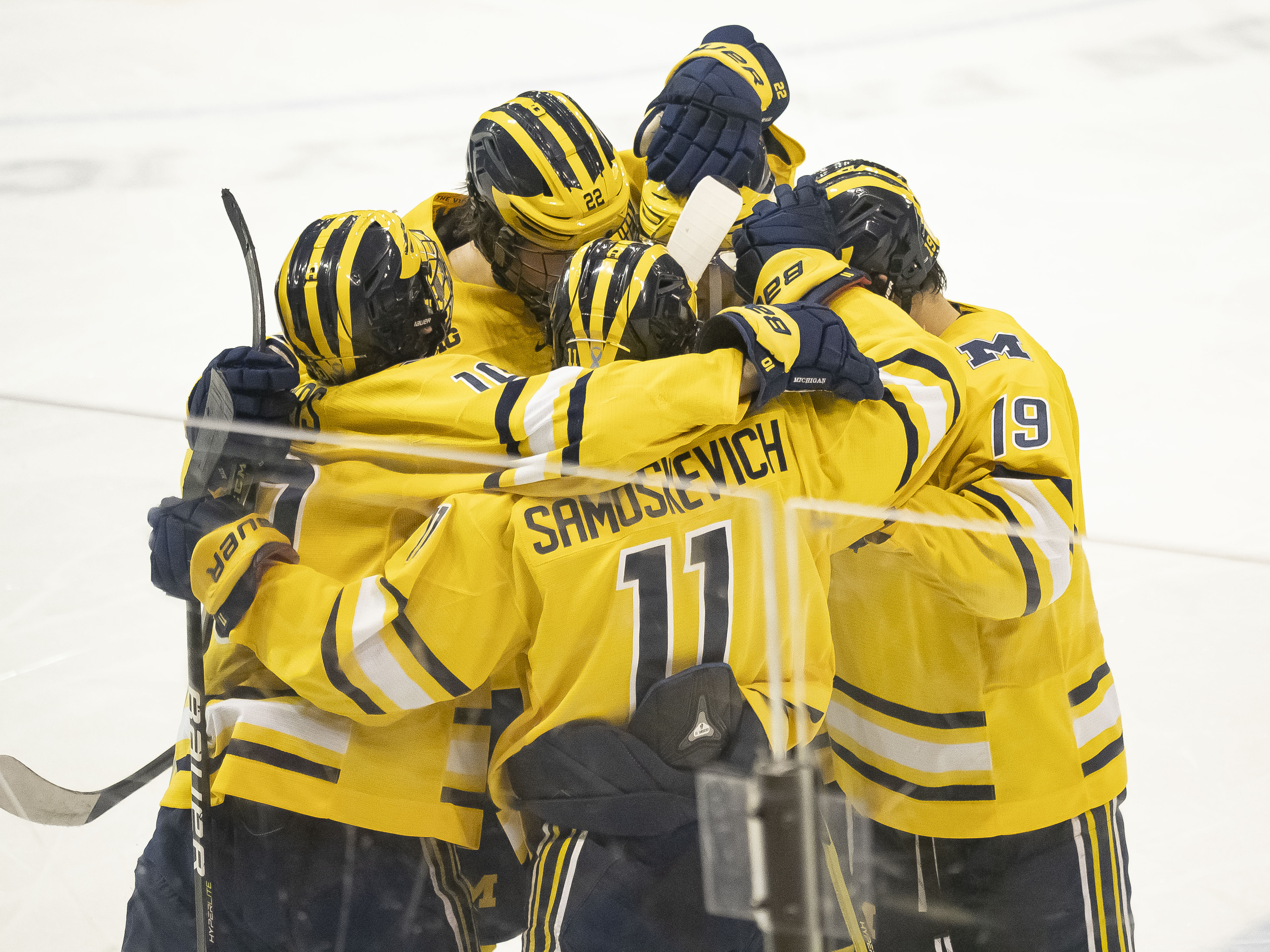 Michigan Wolverines forward Matty Beniers (10) celebrates with his teammates after scoring a goal during a men’s college hockey game between the Michigan Wolverines and the Notre Dame Fighting Irish on February 26th, 2022 at the Compton Family Ice Arena in South Bend IN.