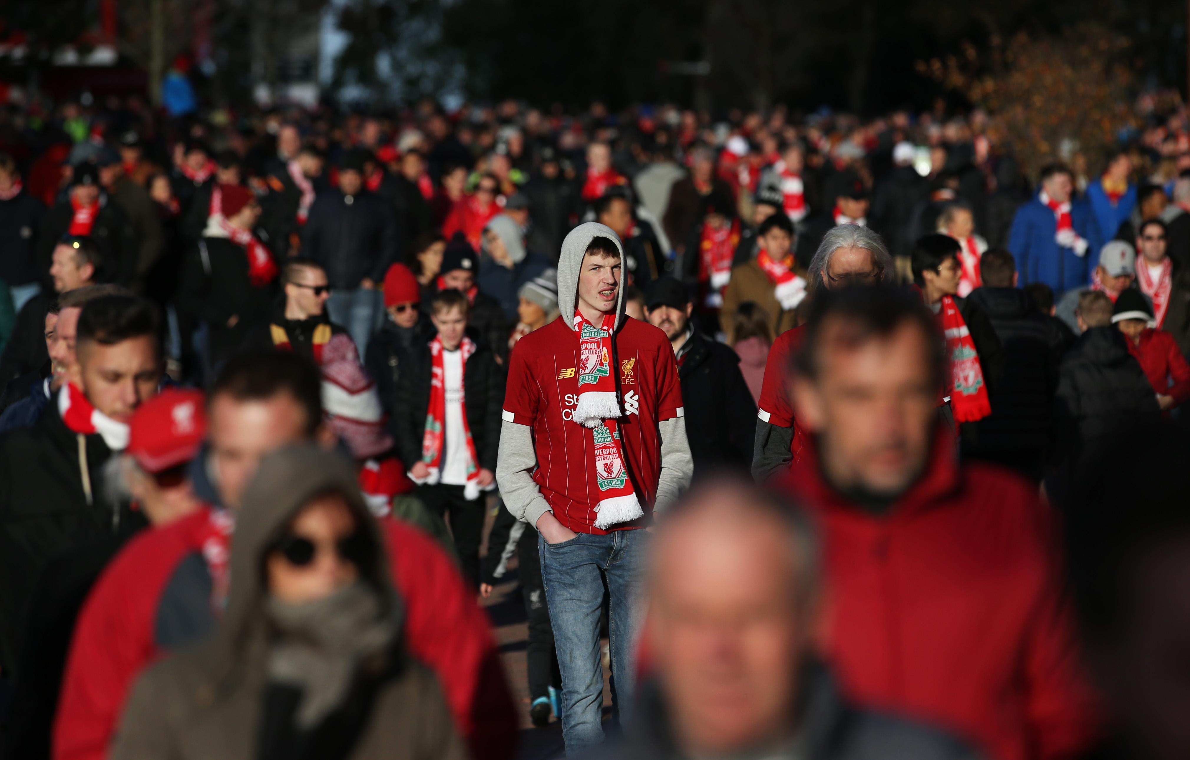 Fans walk to the stadium prior to the Premier League match between Liverpool FC and Tottenham Hotspur at Anfield on October 27, 2019 in Liverpool, United Kingdom.