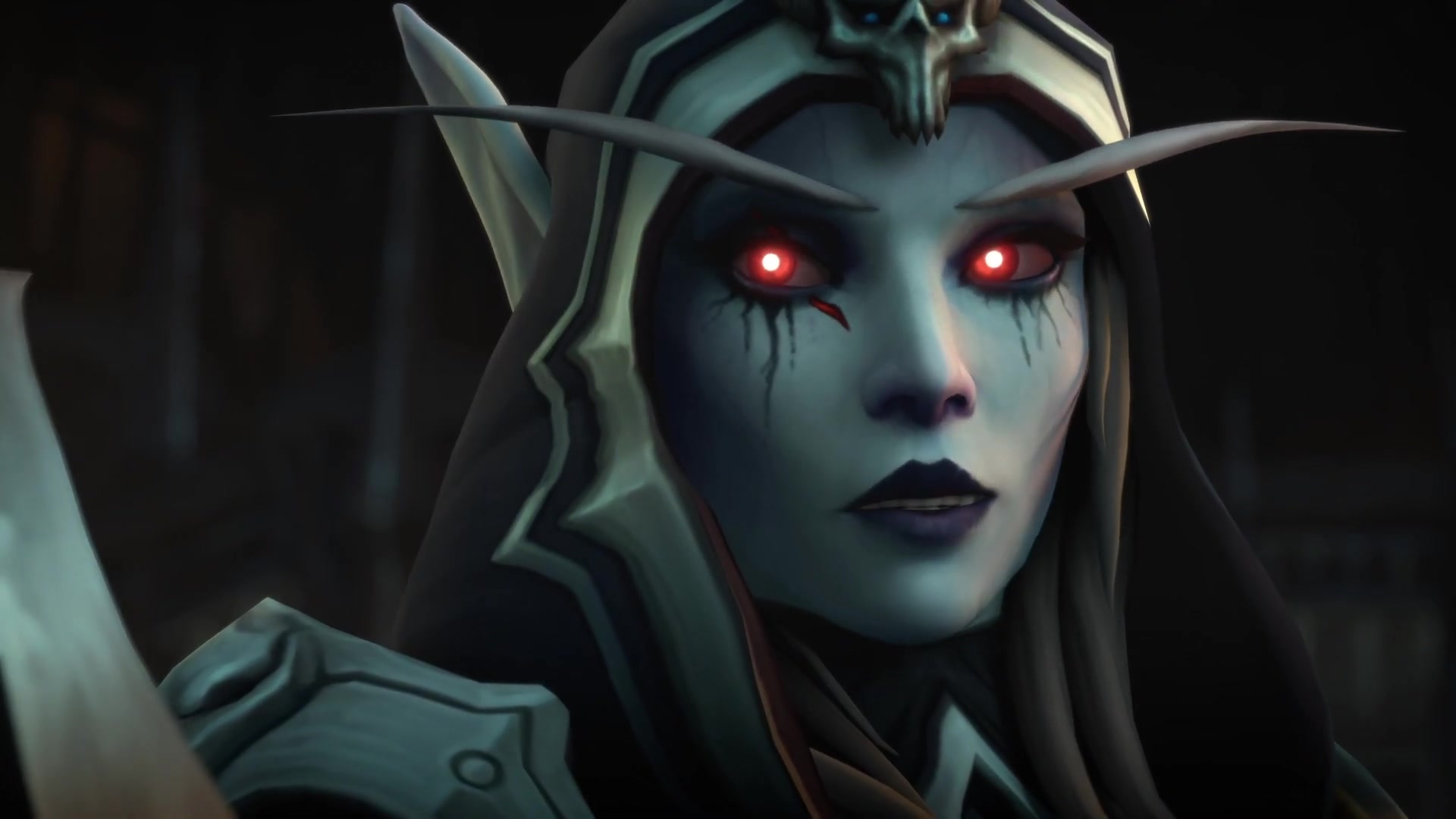 World of Warcraft: Shadowlands - Sylvanas Windrunner, an undead elf with bright red eyes, speaks to a figure off-camera with a hopeful expression.