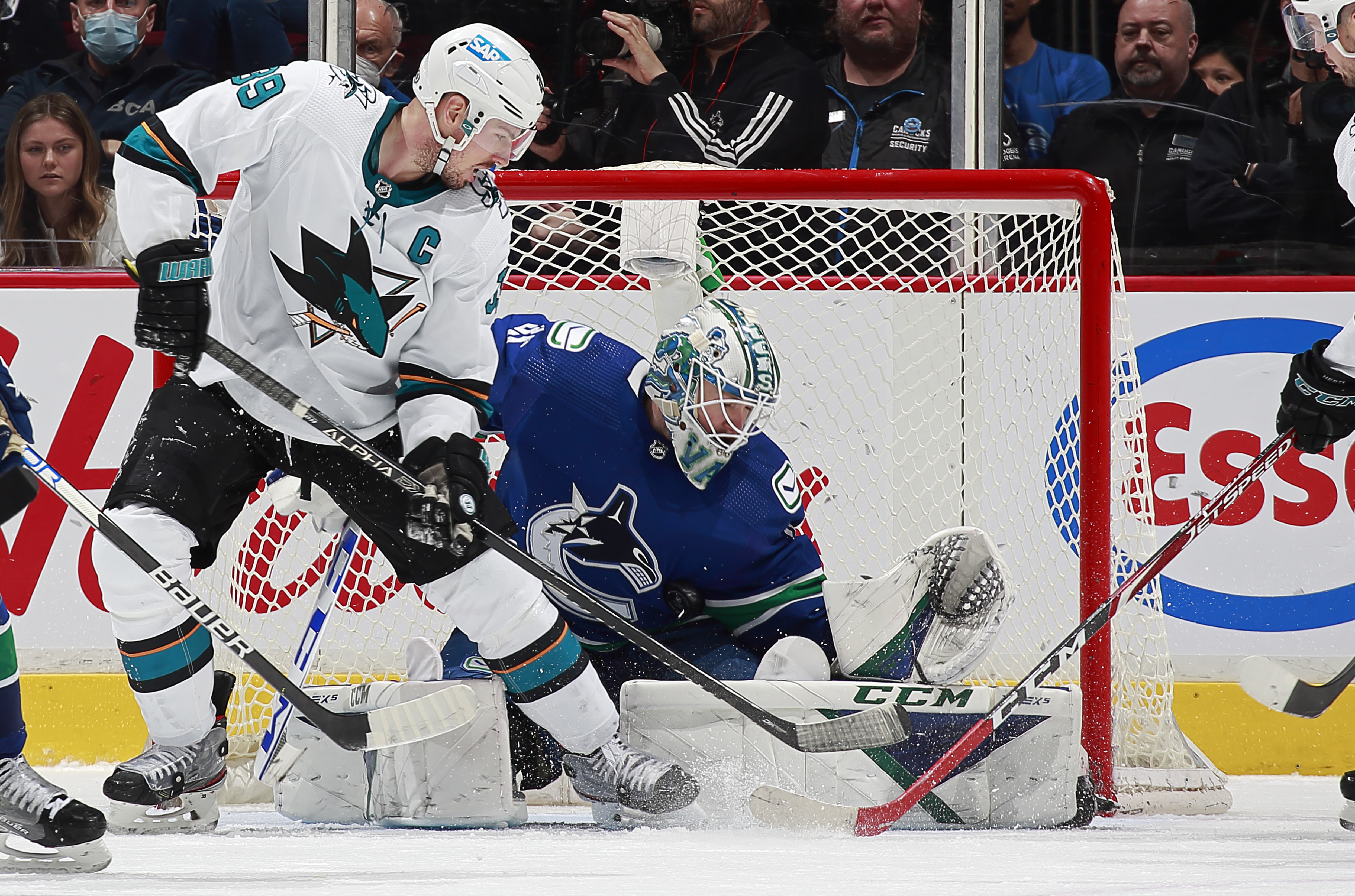 Thatcher Demko #35 of the Vancouver Canucks makes a save against Logan Couture #39 of the San Jose Sharks during their NHL game at Rogers Arena April 9, 2022 in Vancouver, British Columbia, Canada.