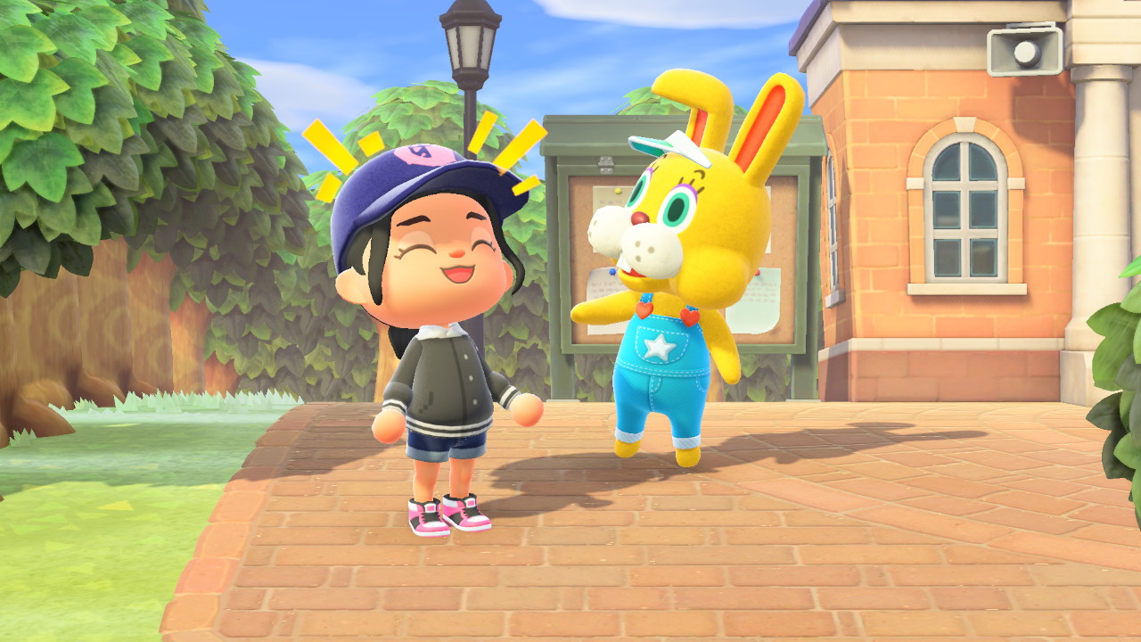 An Animal Crossing laughs alongside a jumping yellow bunny in overalls