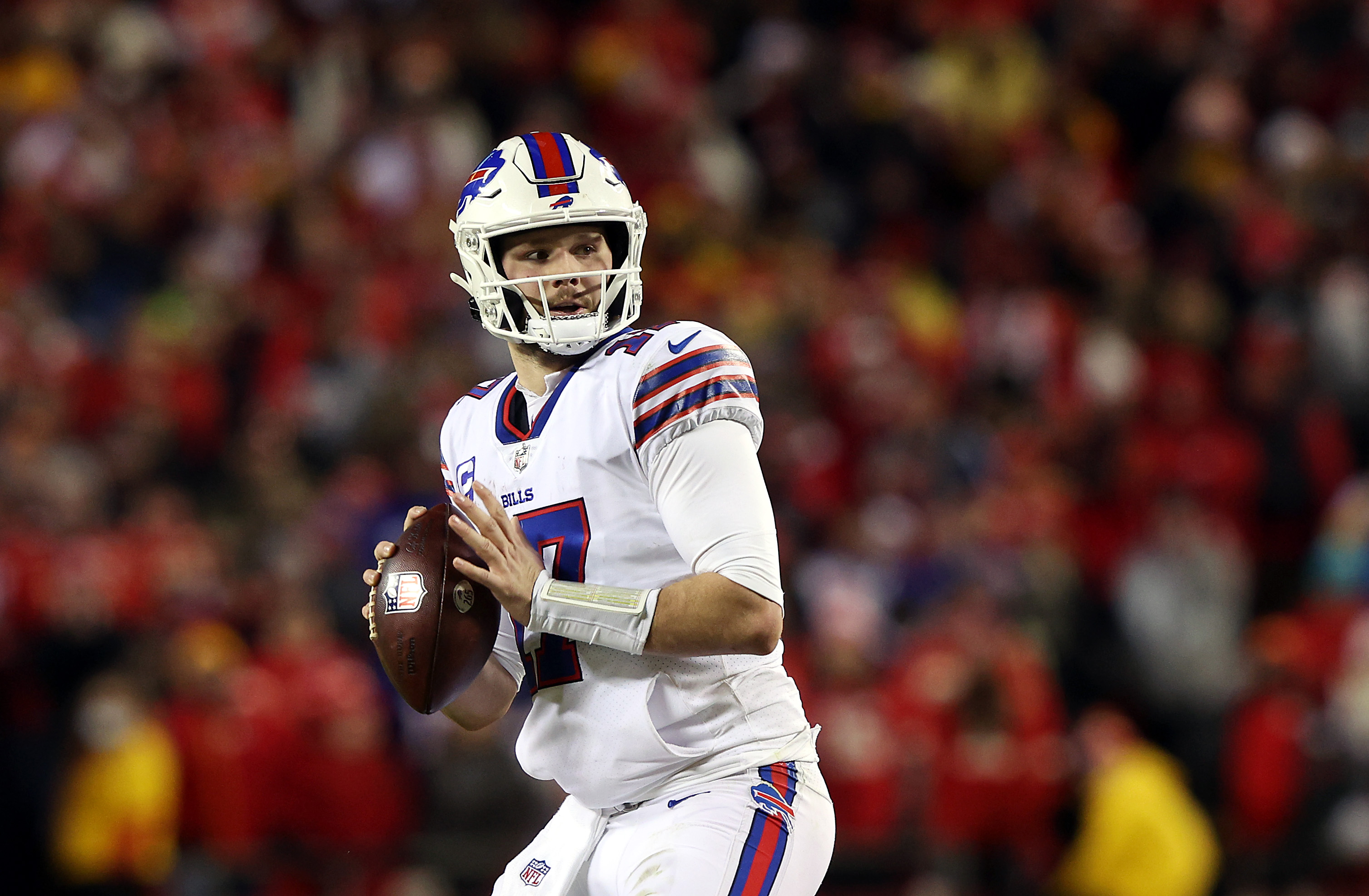 Quarterback Josh Allen #17 of the Buffalo Bills looks to pass during the 4th quarter of the AFC Divisional Playoff game against the Kansas City Chiefs at Arrowhead Stadium on January 23, 2022 in Kansas City, Missouri.