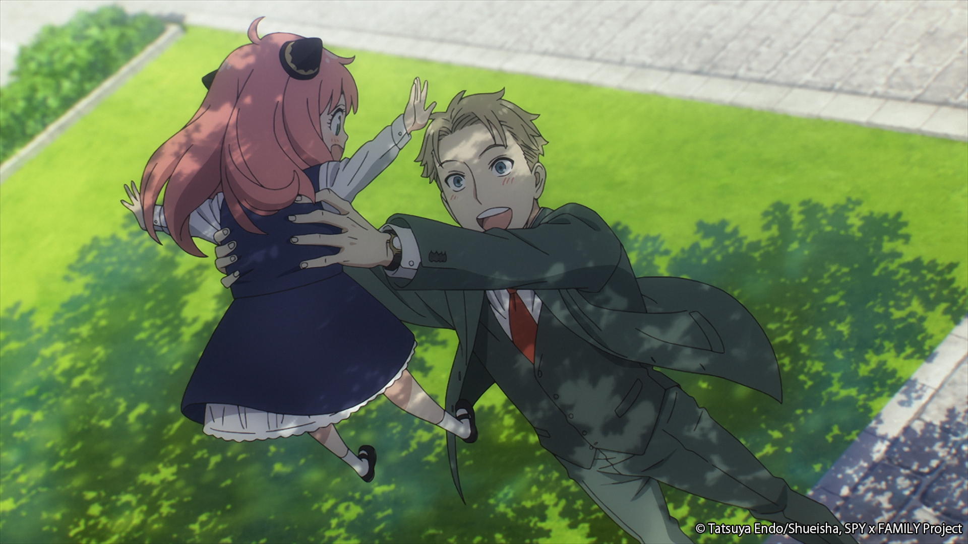 Loid from Spy X Family lifts Anya up in the air to celebrate