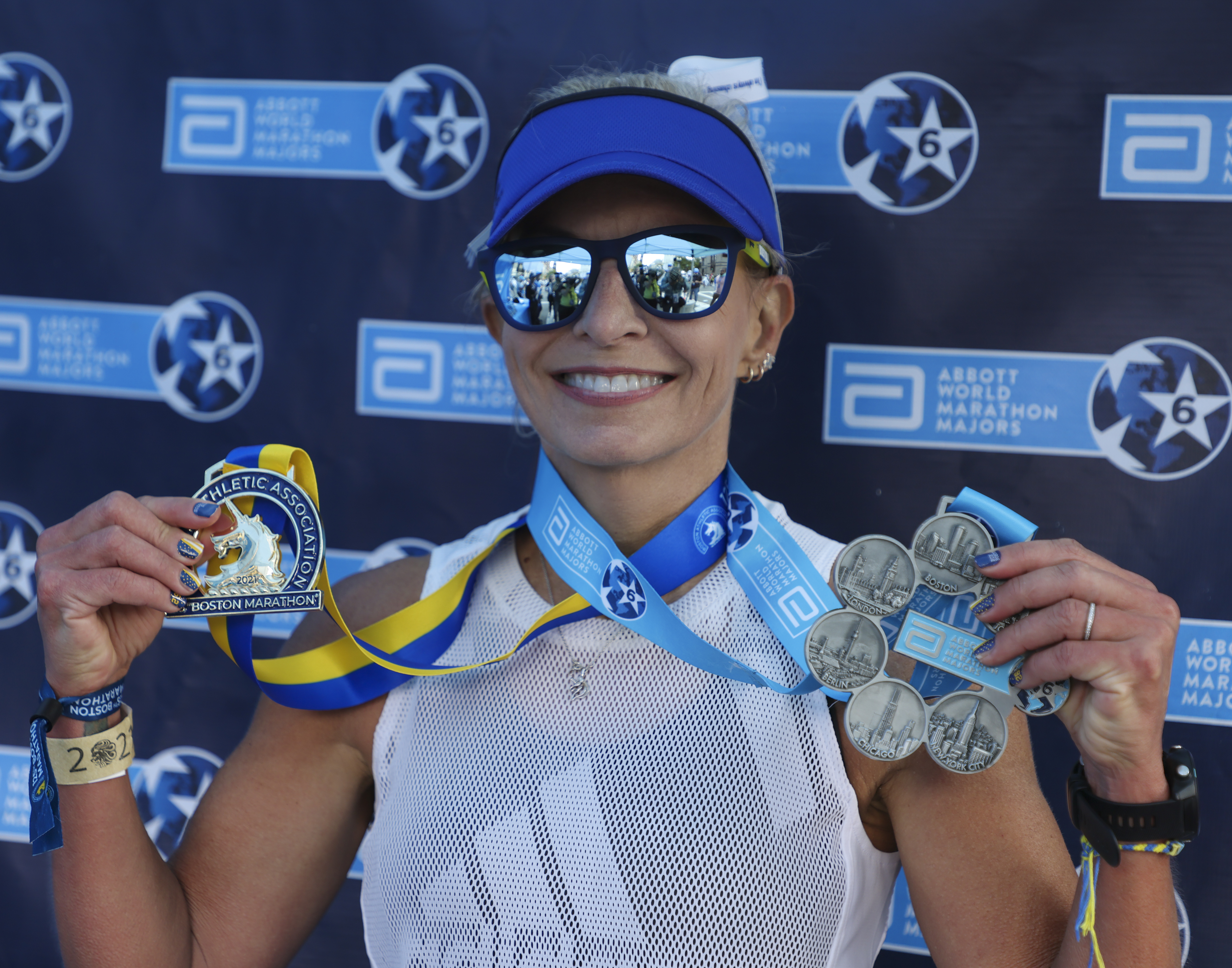 Amy Pelzel, 46, from Denton TX, a recipient of the World Marathon Majors “Six Star” medals, after the finish line of the 125th Boston Marathon in Boston on Oct. 11, 2021.