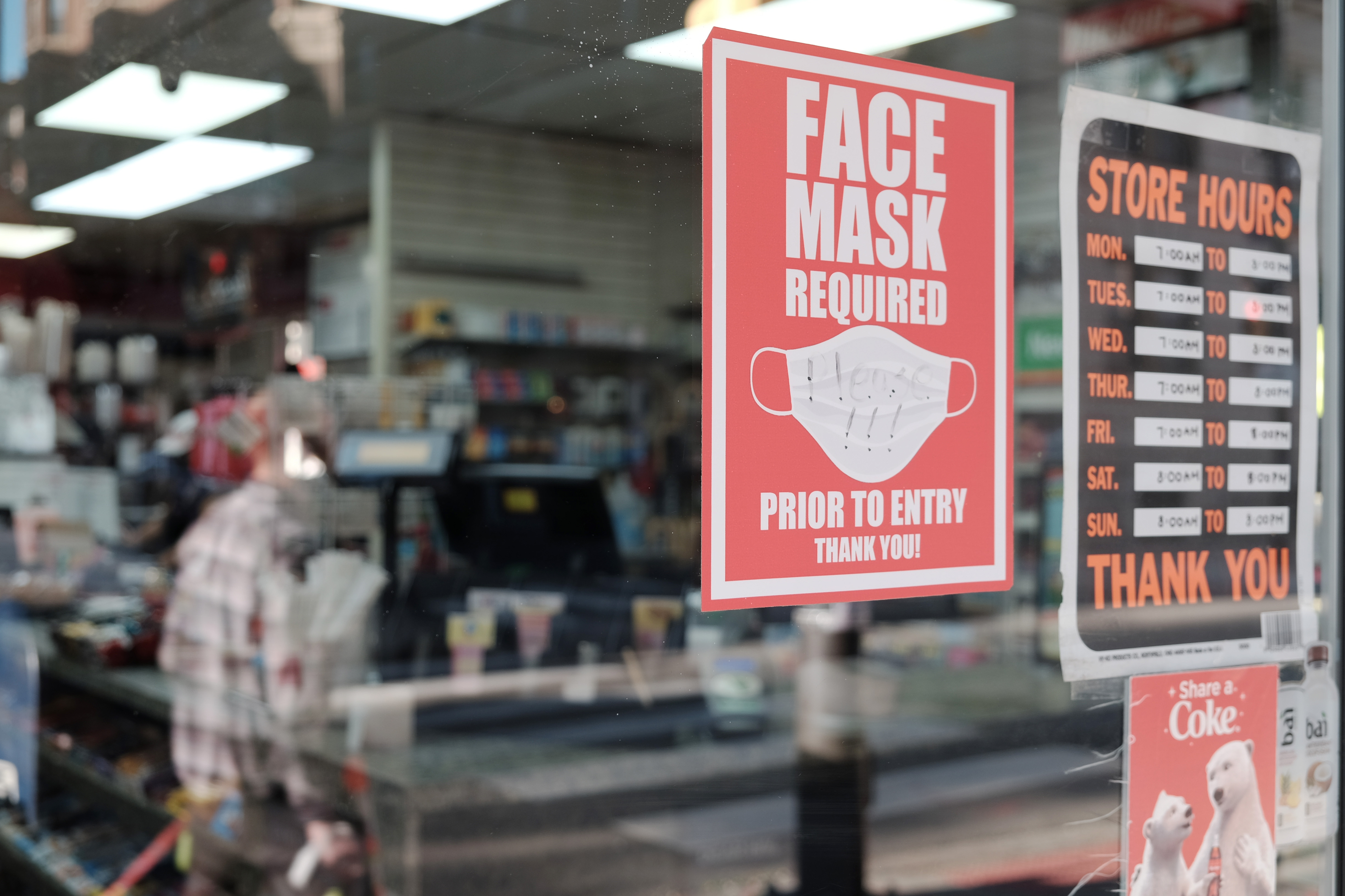 A sign on a door asks people to wear masks in downtown on April 15, 2022 in Philadelphia, Pennsylvania. 