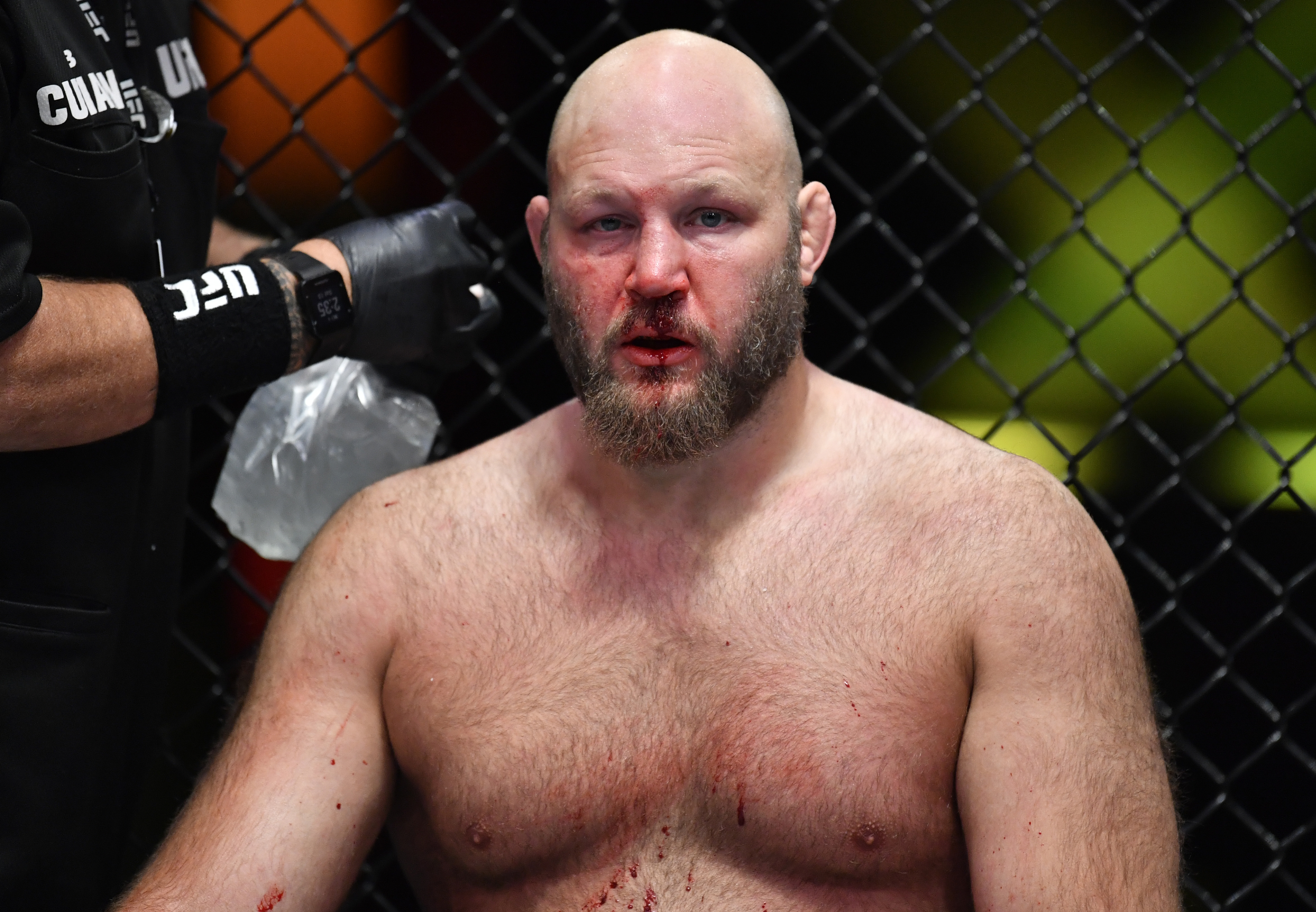 A bloodied-up Ben Rothwell sits on the stool after his November 2021 loss to Marcos Rogerio de Lima.