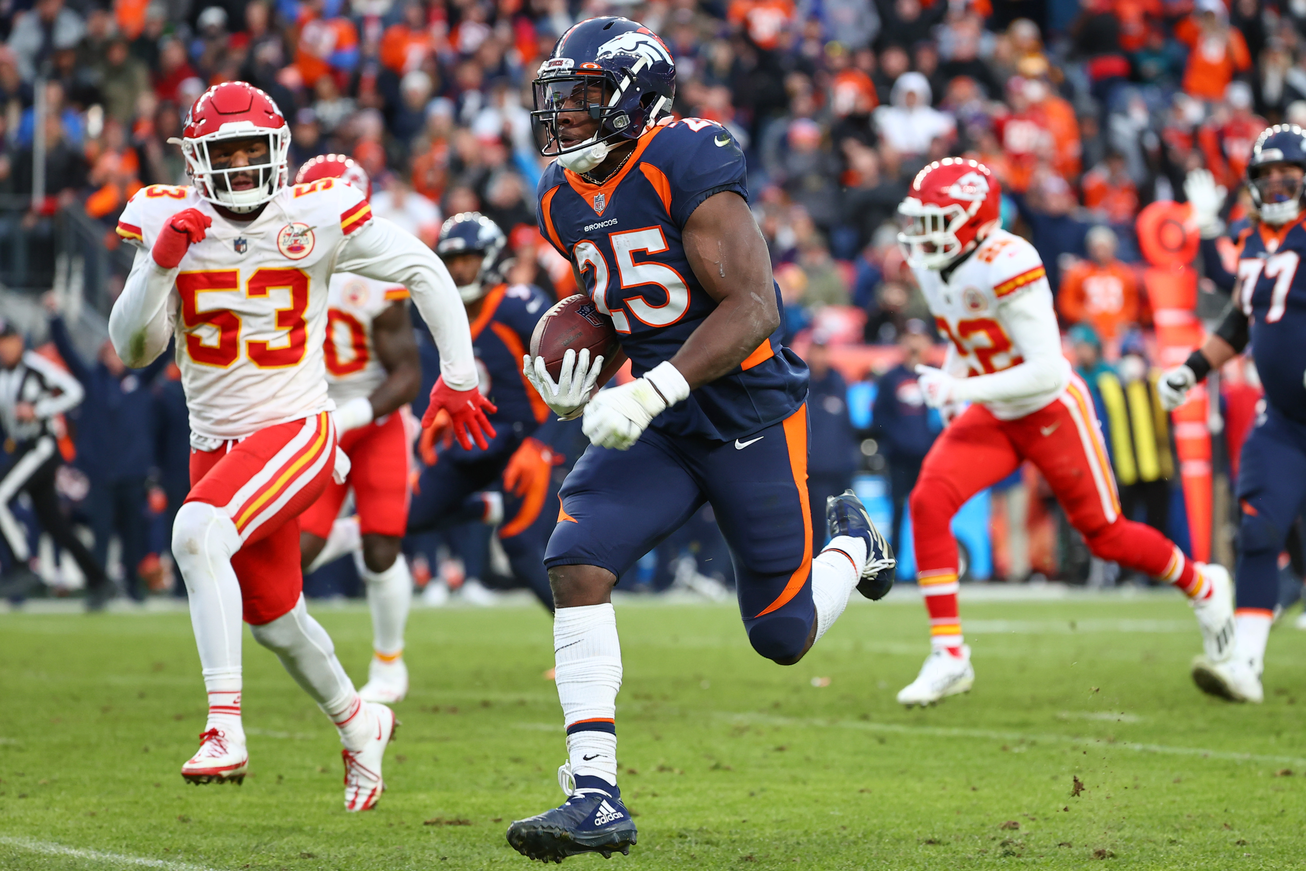 Melvin Gordon #25 of the Denver Broncos rushes for a touchdown during the third quarter against the Kansas City Chiefs at Empower Field At Mile High on January 08, 2022 in Denver, Colorado.