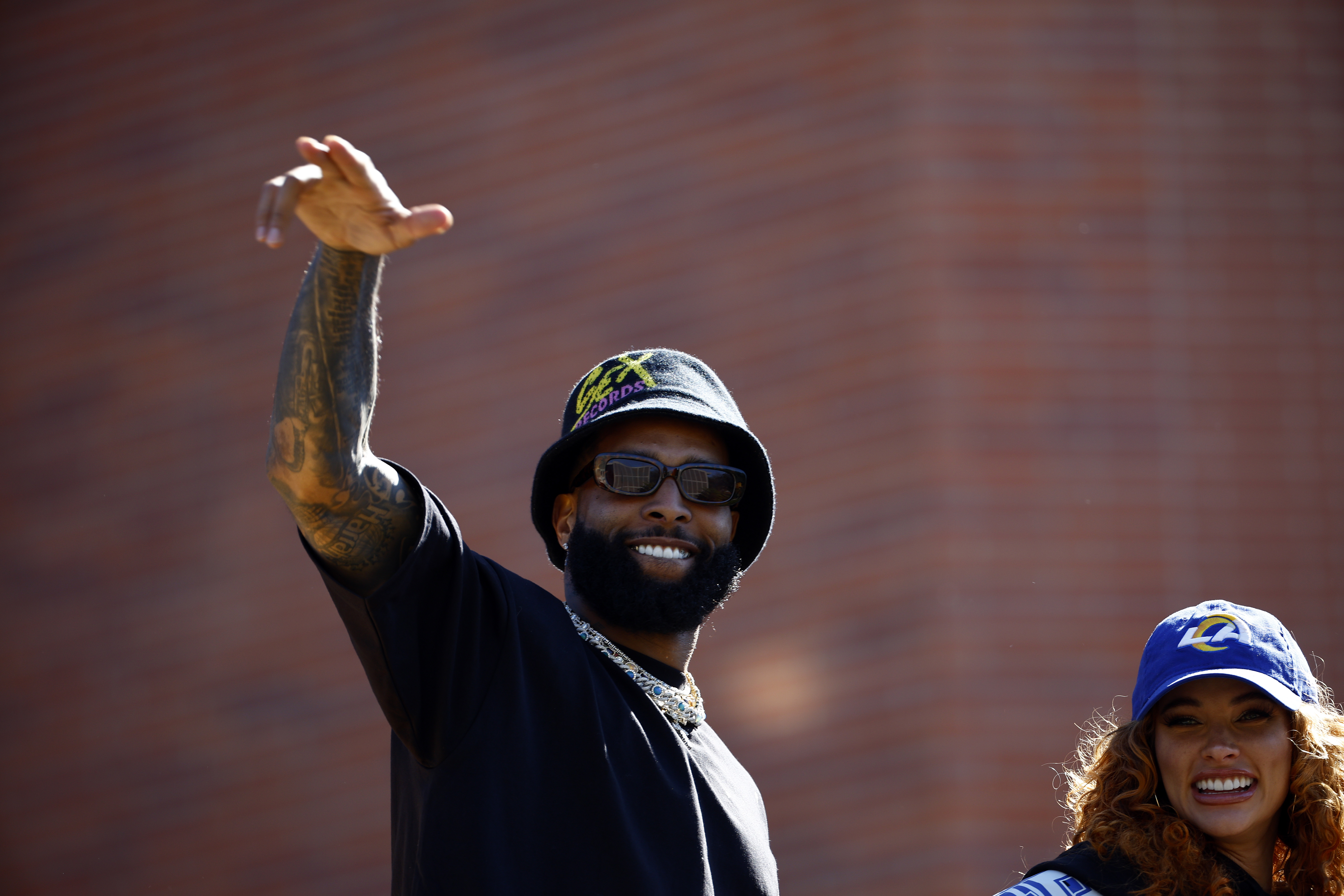 Odell Beckham Jr. #3 of the Los Angeles Rams and Lauren Wood celebrate during the Los Angeles Rams Super Bowl LVI Victory Parade on February 16, 2022 in Los Angeles, California.
