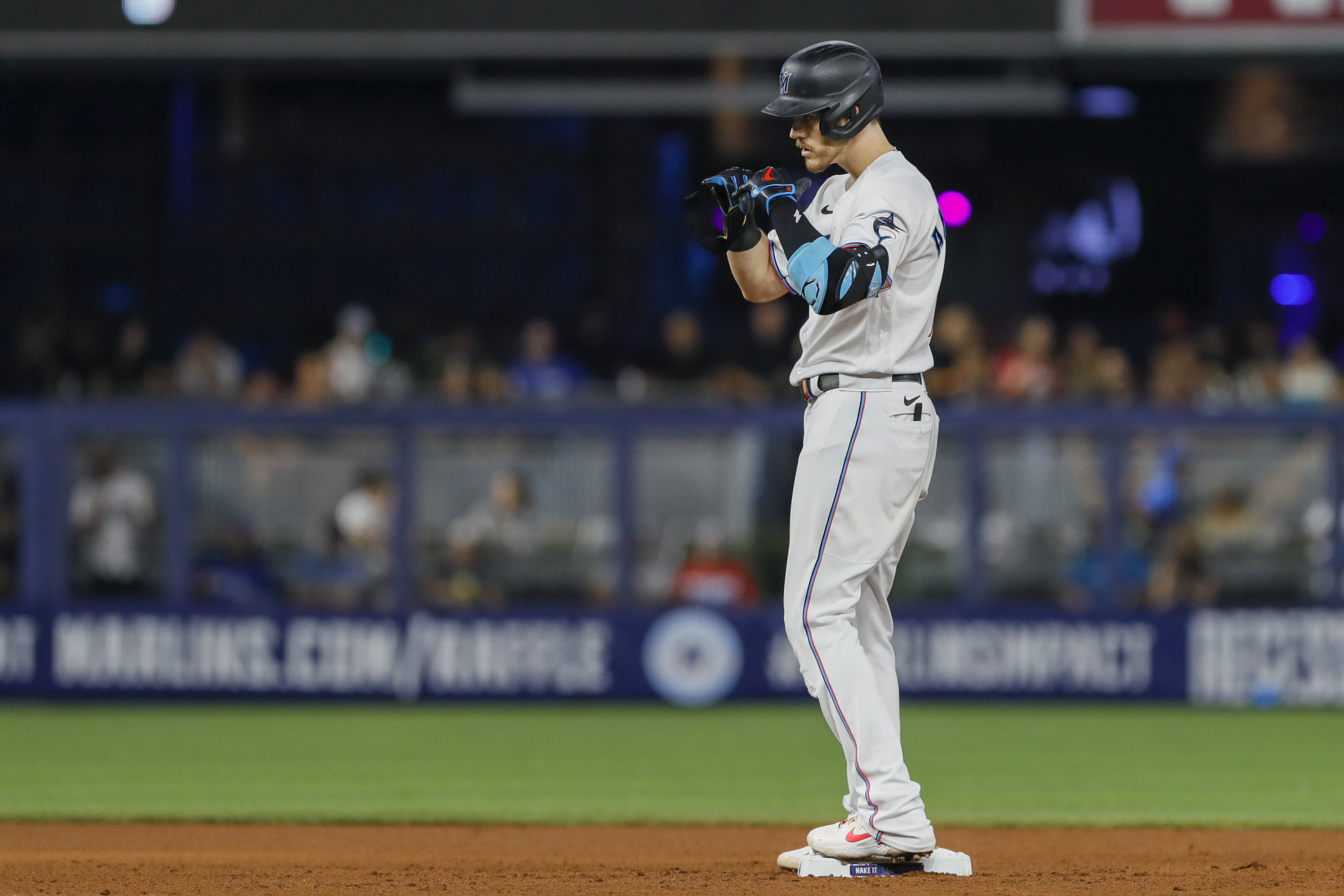 Miami Marlins third baseman Brian Anderson (15) reacts from second base after hitting a double in the fifth inning against the Seattle Mariners at loanDepot Park.