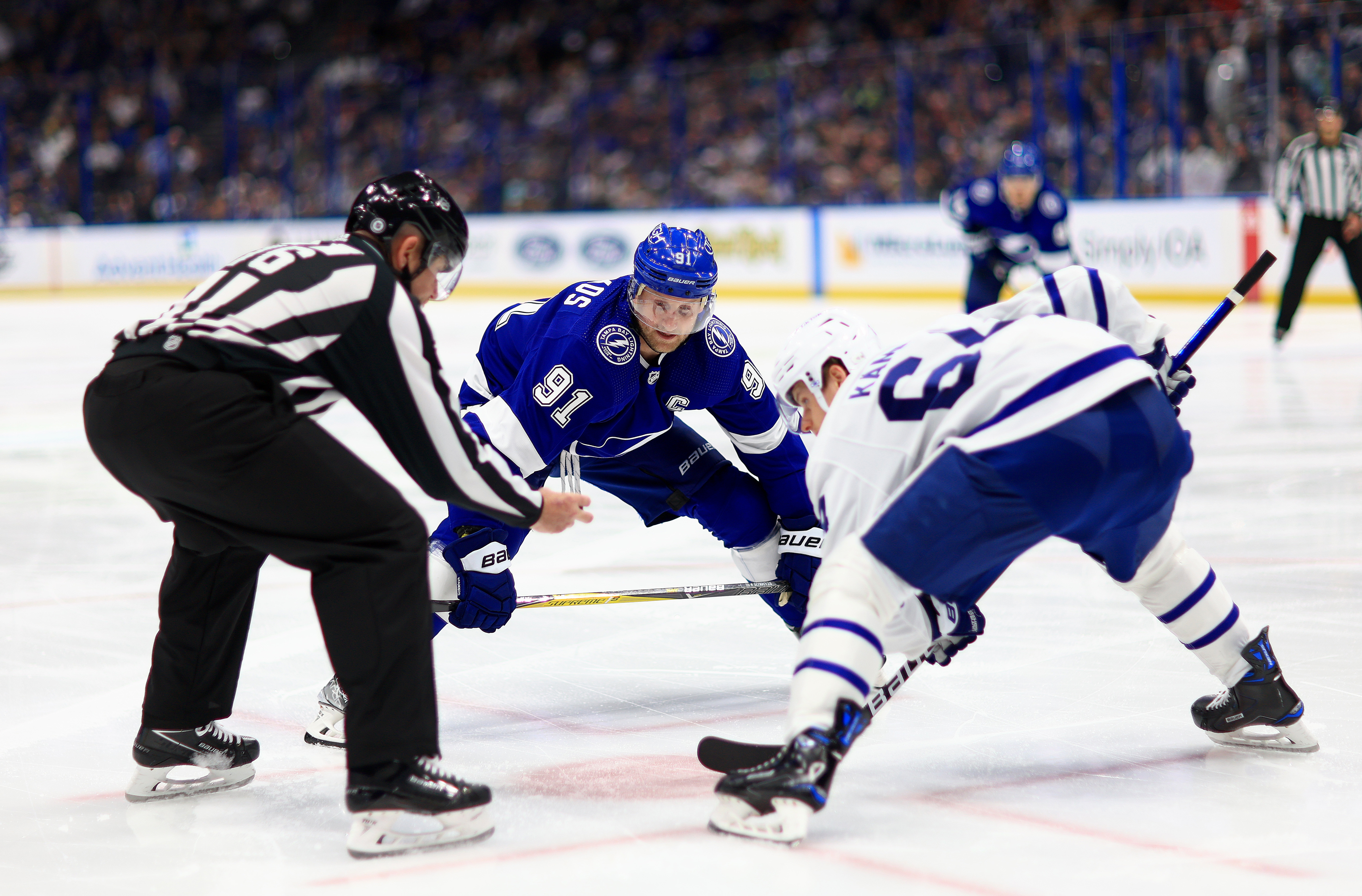 Steven Stamkos #91 of the Tampa Bay Lightning and David Kampf #64 of the Toronto Maple Leafs face off in the second period during a game at Amalie Arena on April 21, 2022 in Tampa, Florida.