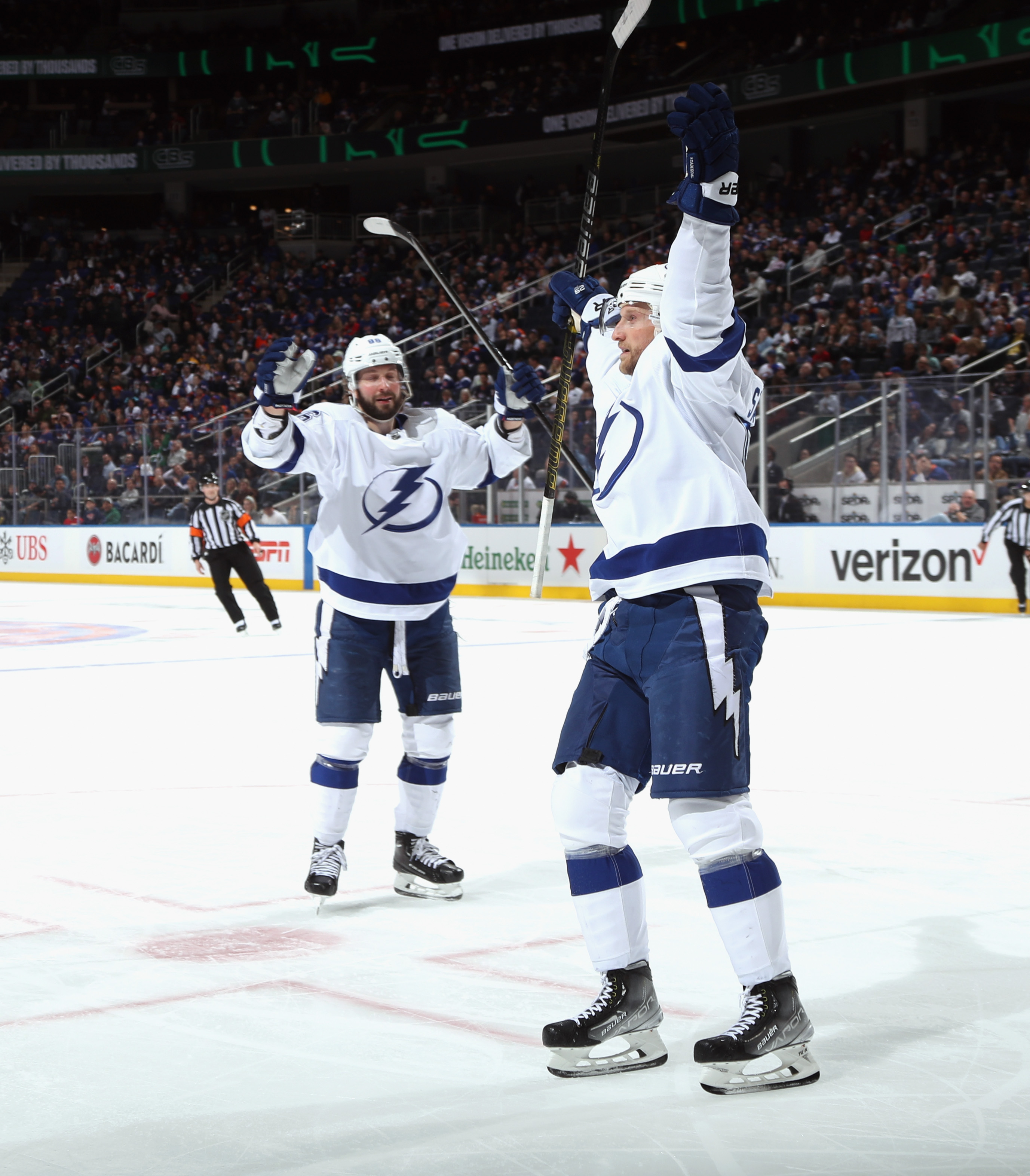 Steven Stamkos of the Tampa Bay Lightning celebrates his goal at 11:13 of the third period against the New York Islanders and is joined by Nikita Kucherov at UBS Arena on April 29, 2022 in Elmont, New York.