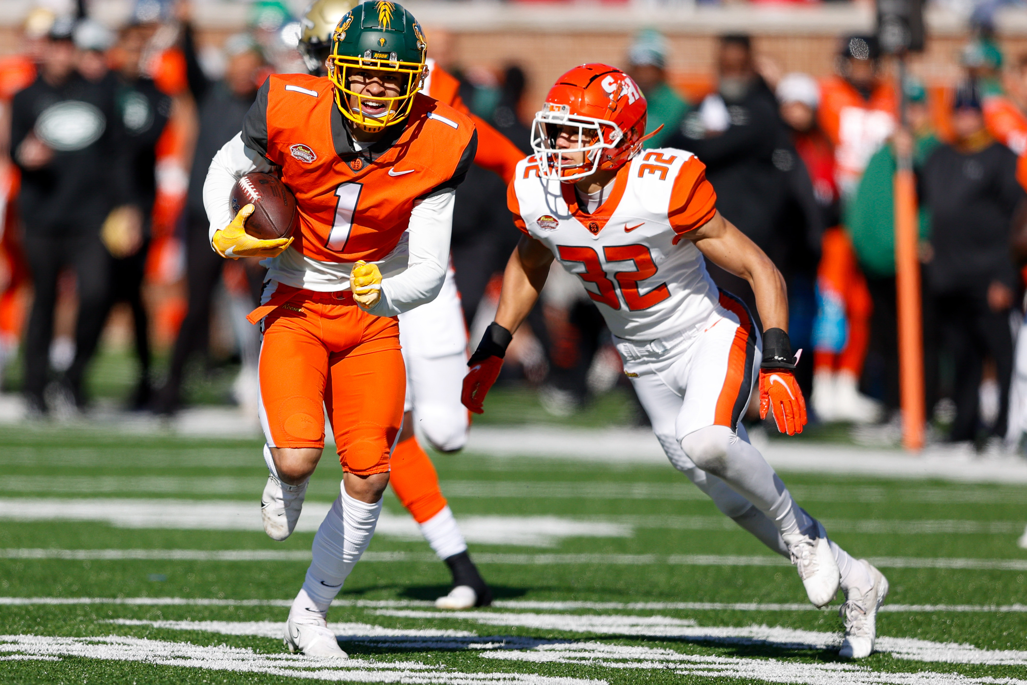 National Squad wide receiver Christian Watson of North Dakota State (1) runs with the ball in the first half against the American squad during the Senior bowl at Hancock Whitney Stadium.&nbsp;