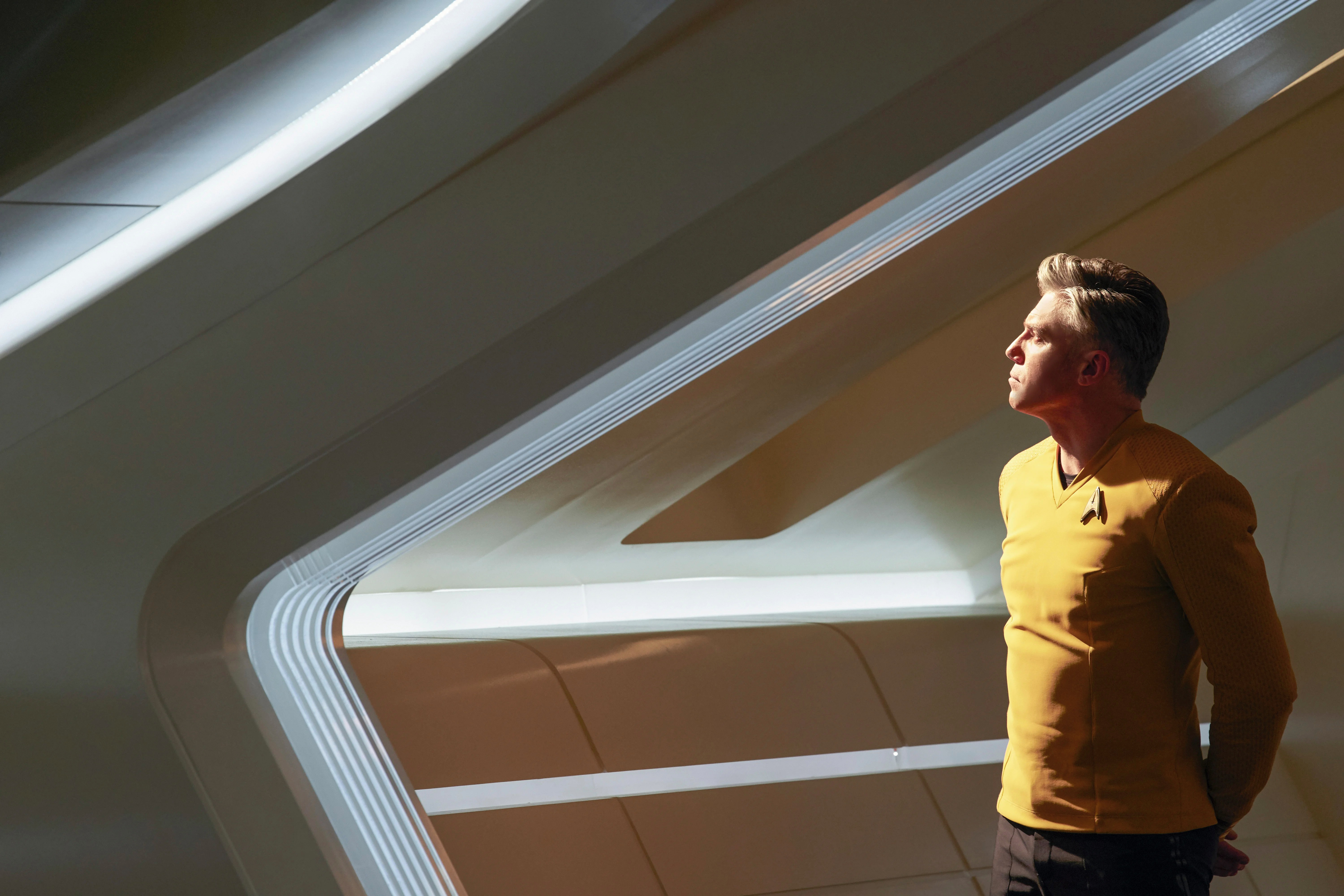 Christopher Pike standing and looking out the window of his ship, all pensive and shit