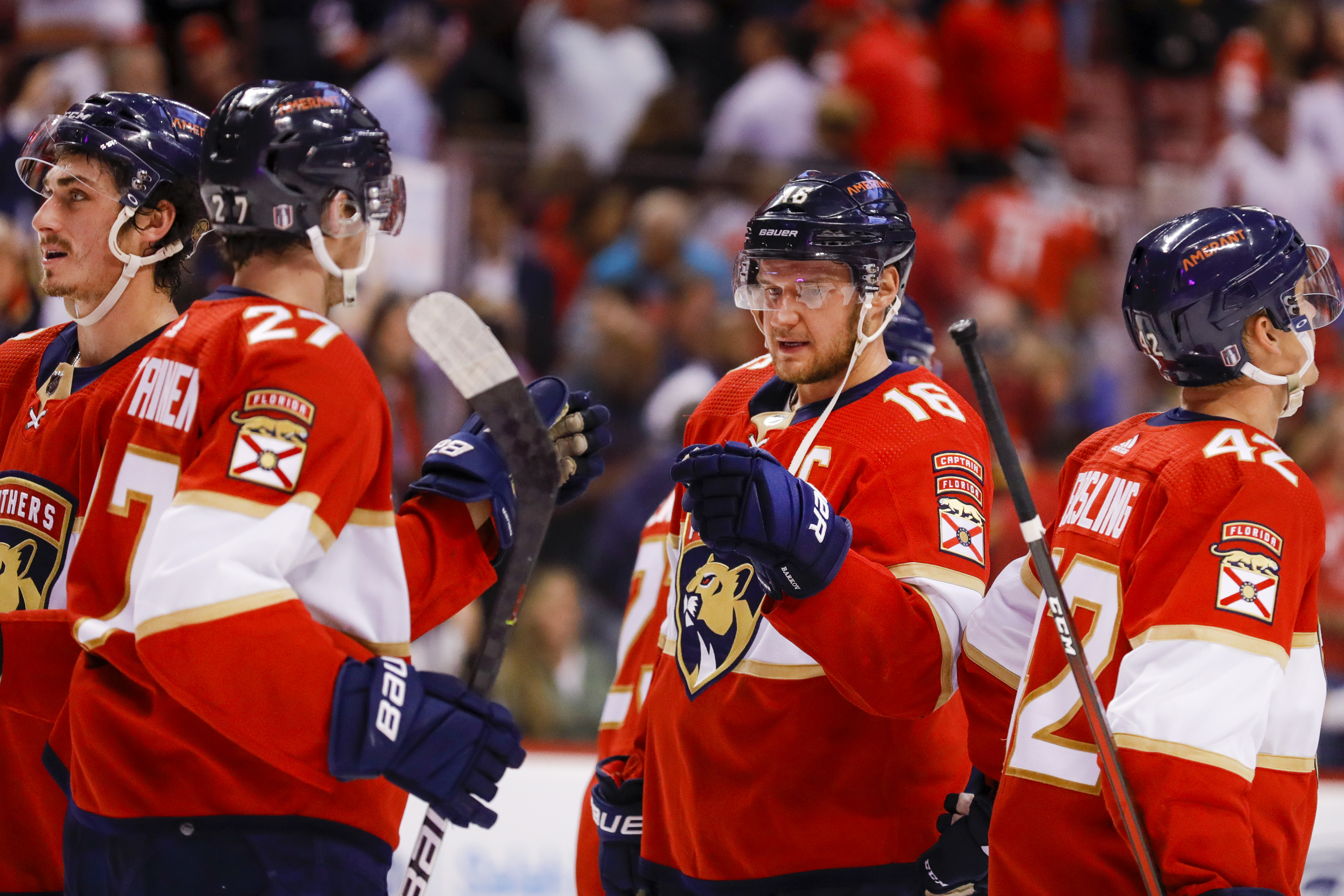 Florida Panthers center Aleksander Barkov (16) celebrates with center Eetu Luostarinen (27) after winning against the Washington Capitals in Game 2 of the first round of the 2022 Stanley Cup Playoffs at FLA Live Arena.
