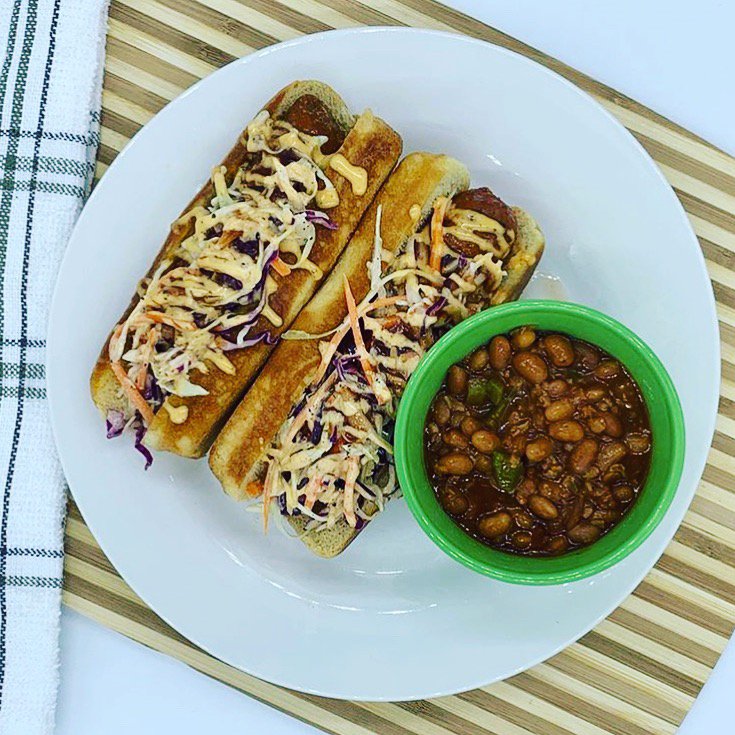 Vegan sausage sandwiches with a side of vegan baked beans.