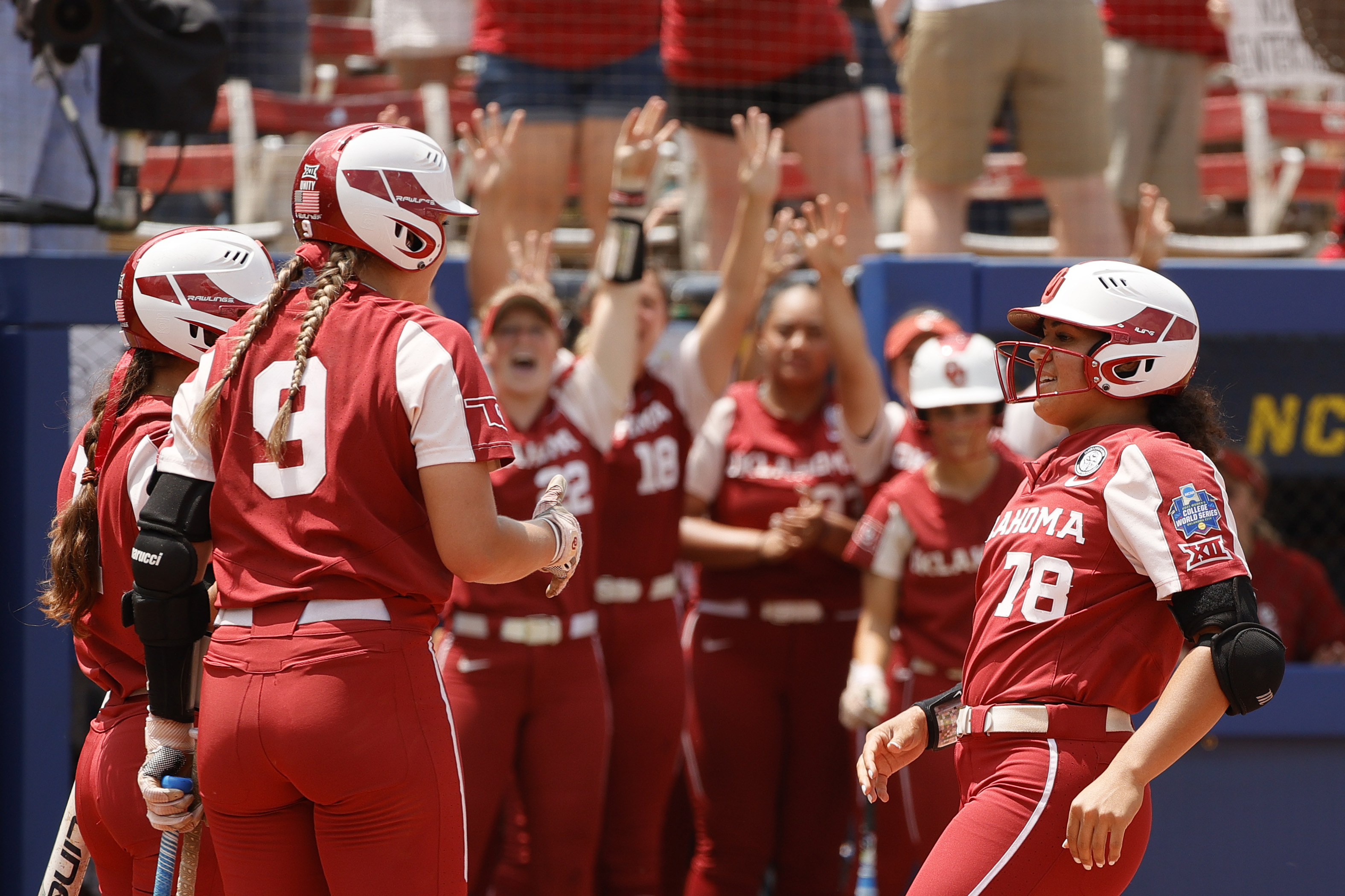 Jocelyn Alo of the Oklahoma Sooners reacts with teammates as she scores on a solo home run during the first inning of Game 3 of the Women’s College World Series Championship against the Florida St. Seminoles at USA Softball Hall of Fame Stadium on June 10, 2021 in Oklahoma City, Oklahoma.
