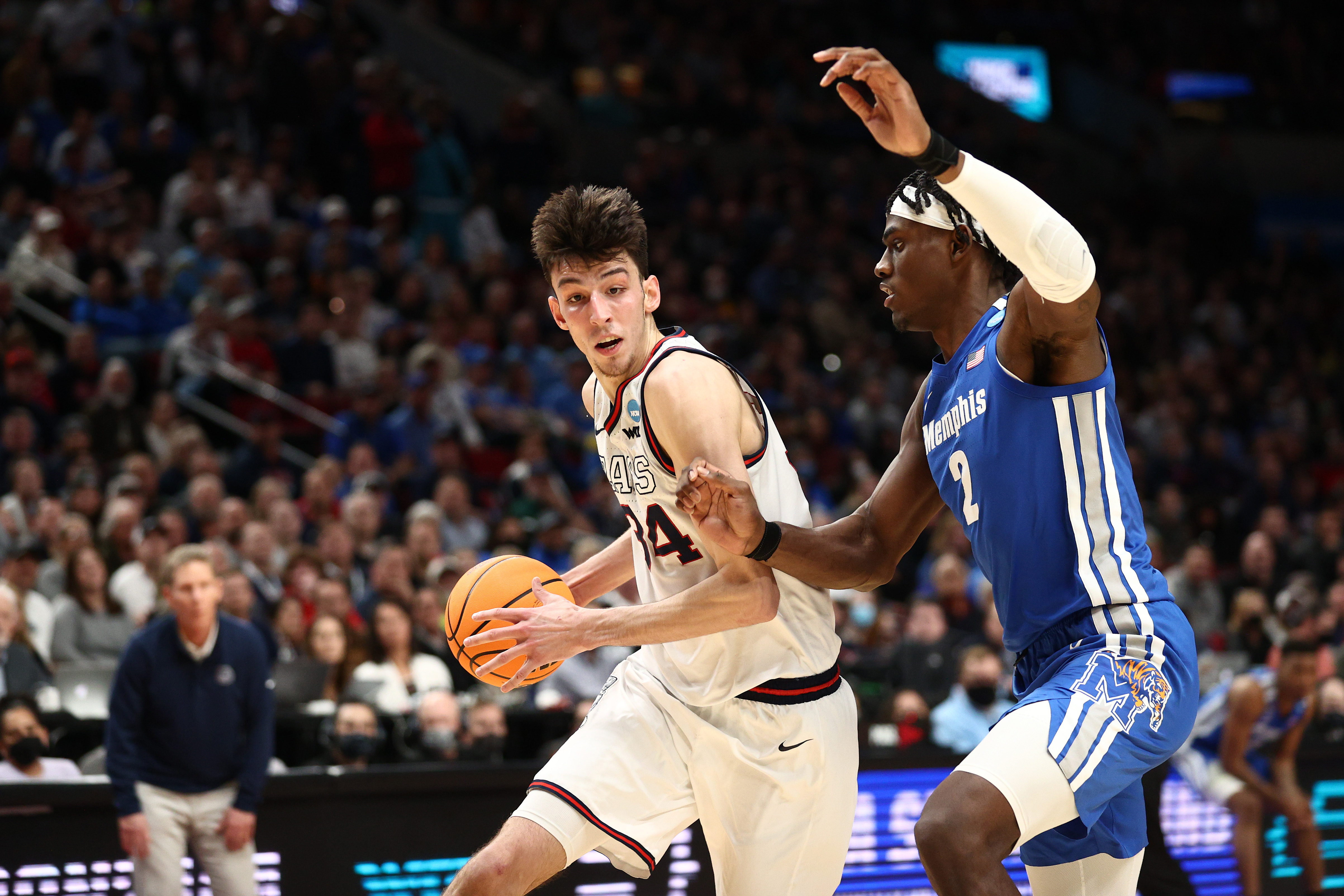 Chet Holmgren #34 of the Gonzaga Bulldogs drives passed Jalen Duren #2 of the Memphis Tigers during the second half in the second round of the 2022 NCAA Men’s Basketball Tournament at Moda Center on March 19, 2022 in Portland, Oregon.