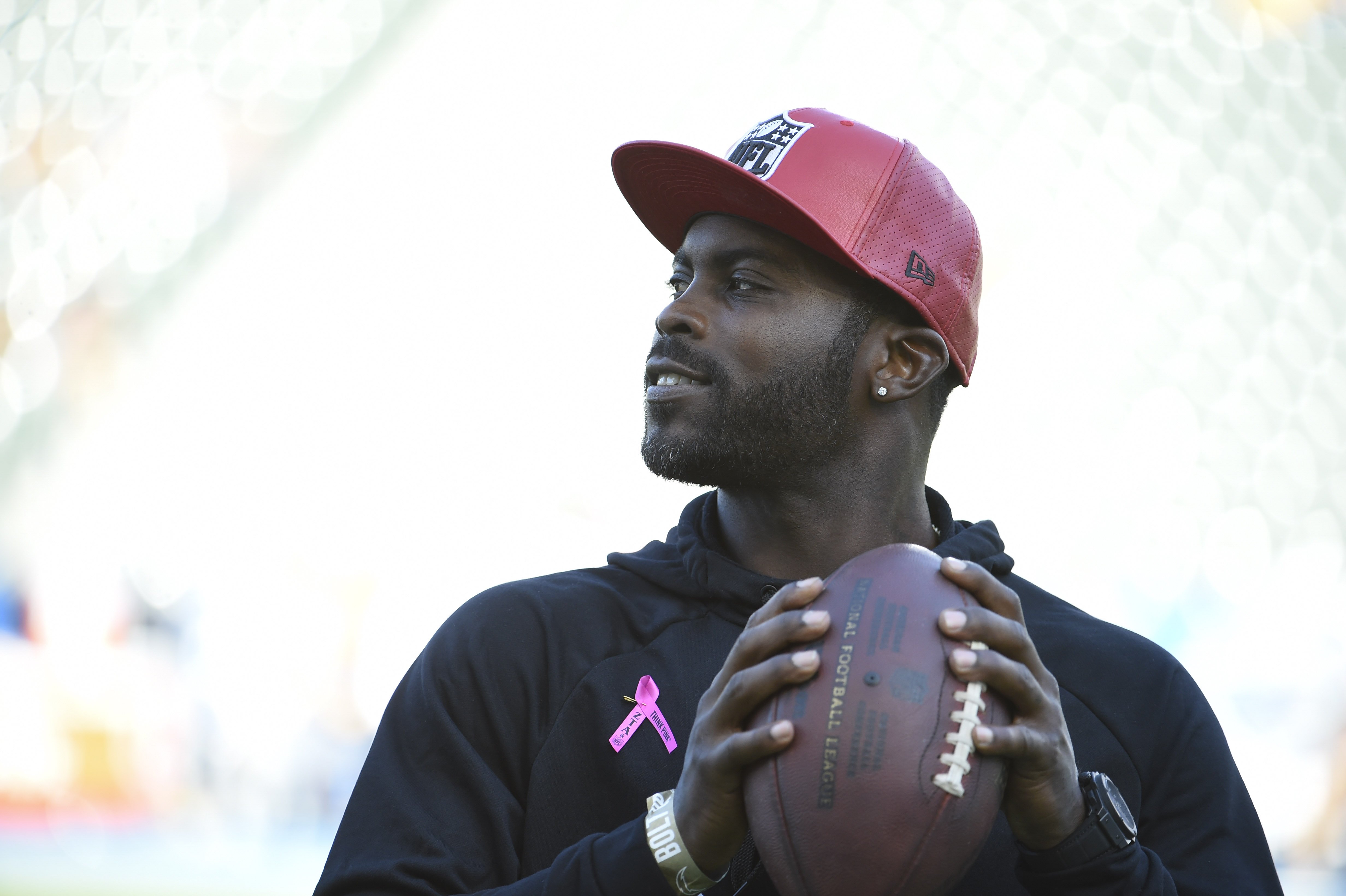 Former NFL quarterback Michael Vick stands on the field before a game between the Pittsburgh Steelers and the Los Angeles Chargers at Dignity Health Sports Park October 13, 2019 in Carson, California.