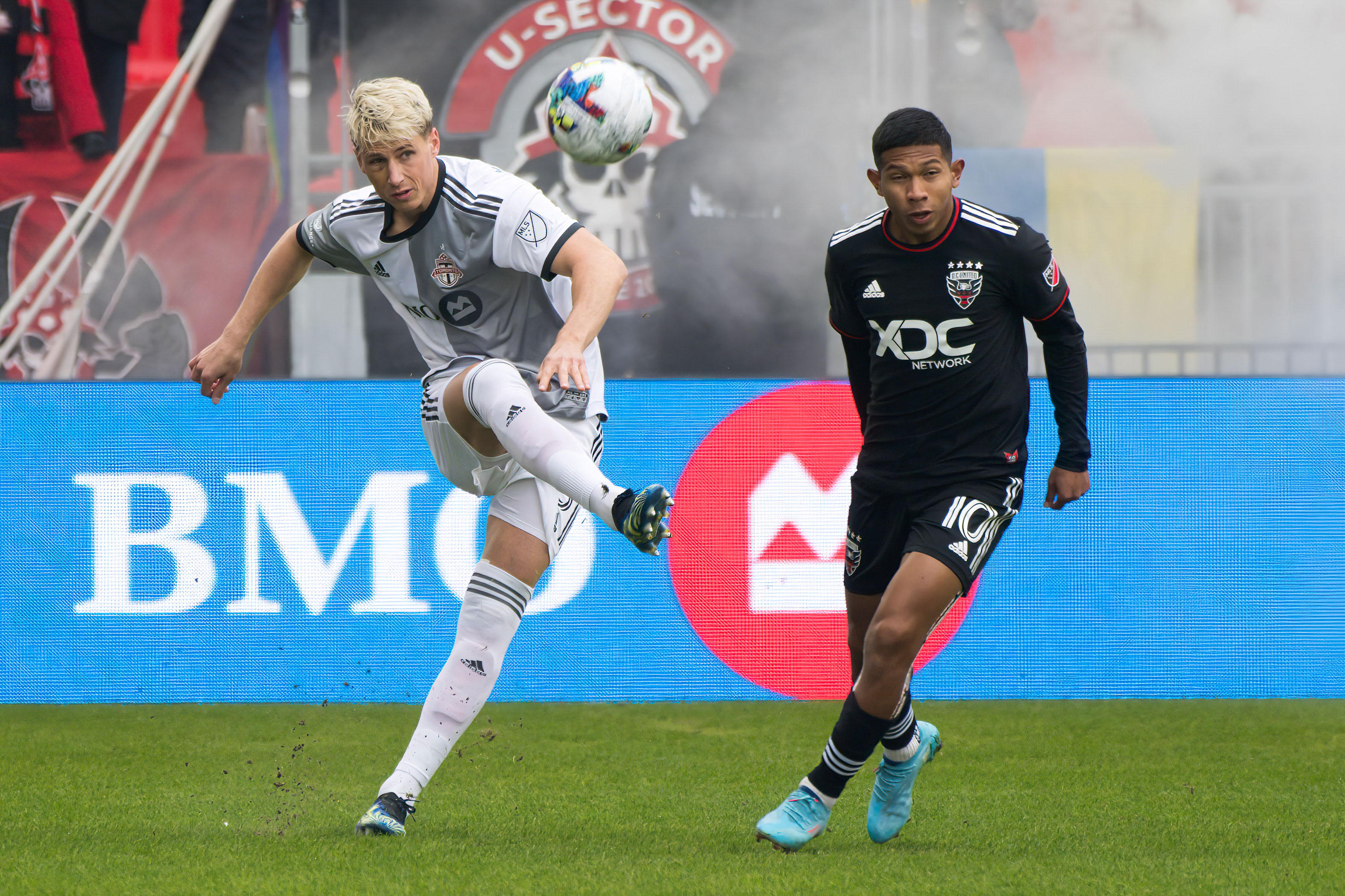 Lukas MacNaughton (5) and Edison Flores (10) in action...