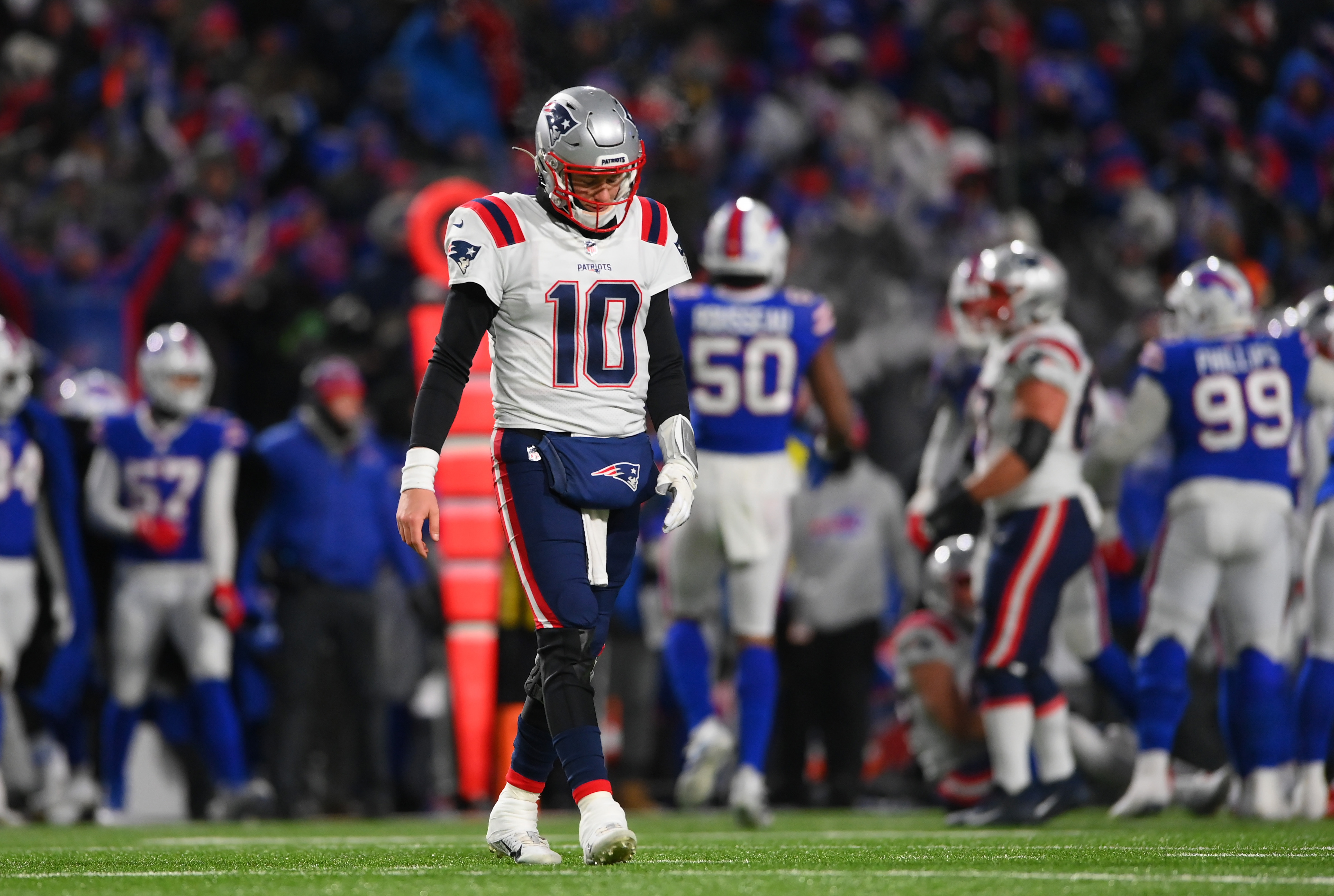 New England Patriots quarterback Mac Jones (10) reacts to an interception during the third quarter of the AFC Wild Card playoff game against the Buffalo Bills at Highmark Stadium.&nbsp;