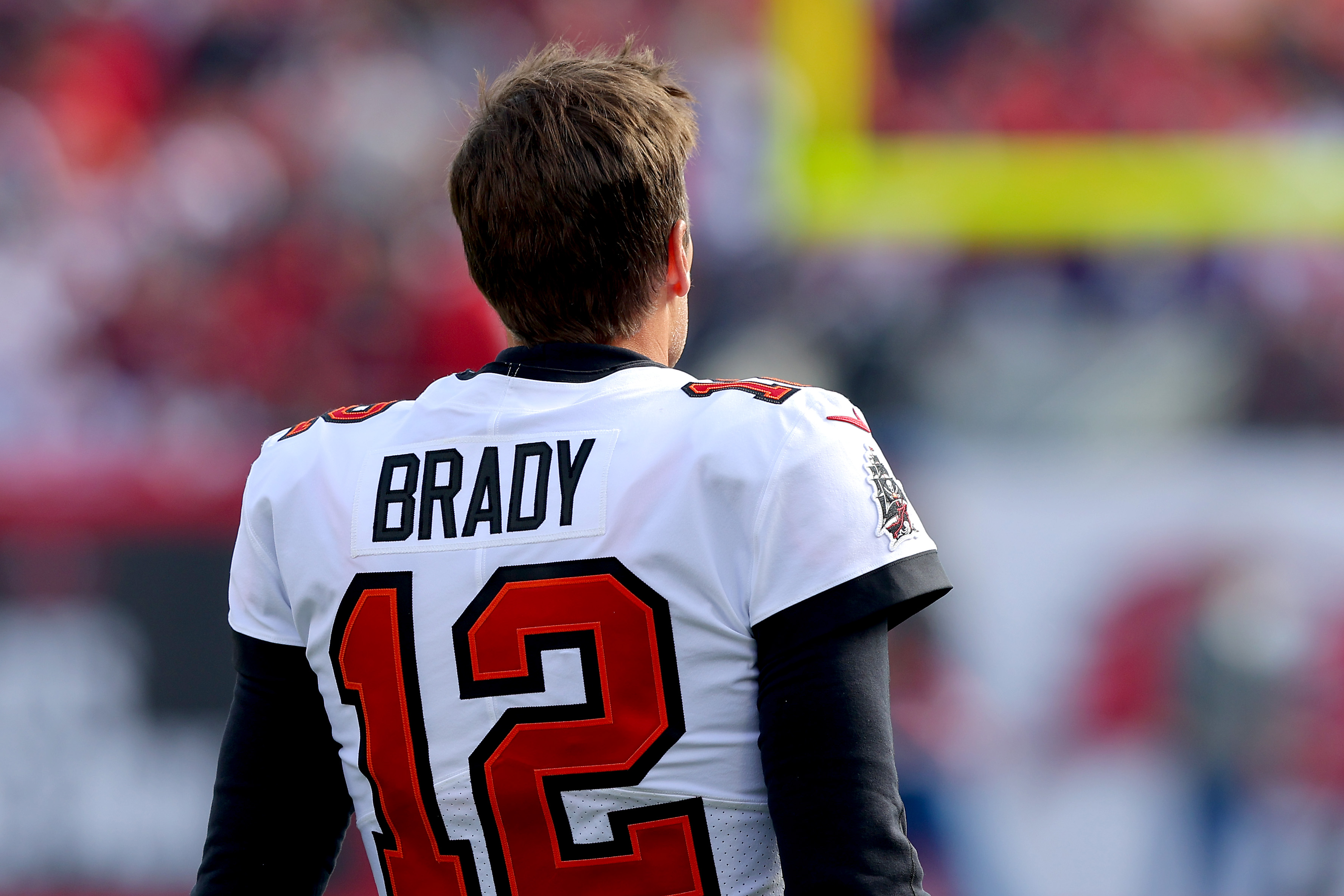 Tom Brady #12 of the Tampa Bay Buccaneers looks on before the game against the Los Angeles Rams in the NFC Divisional Playoff game at Raymond James Stadium on January 23, 2022 in Tampa, Florida.