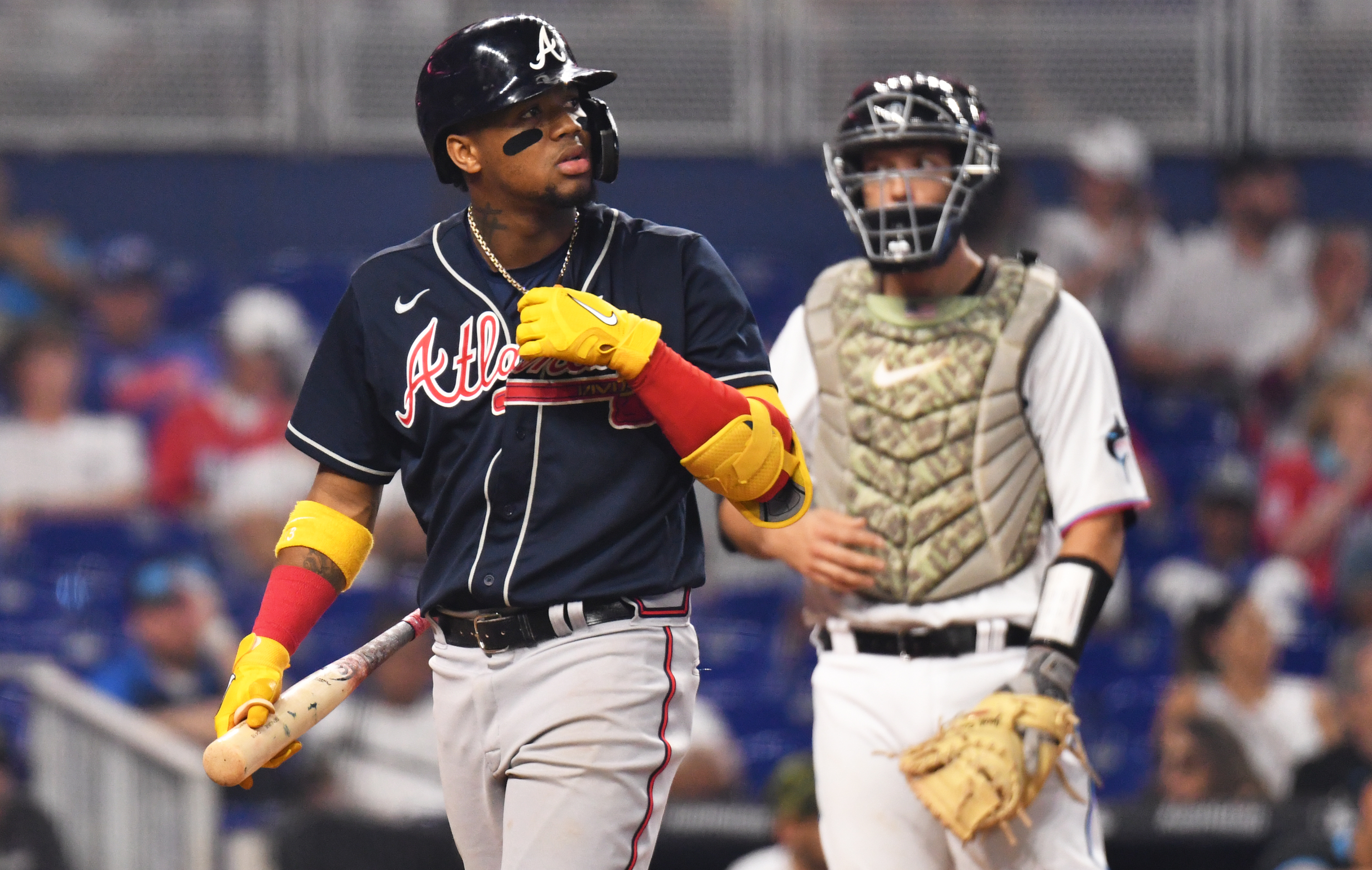 Atlanta Braves right fielder Ronald Acuna Jr. (13) walks back to the dugout after striking out as Miami Marlins catcher Jacob Stallings (58) looks on at loanDepot Park.&nbsp;