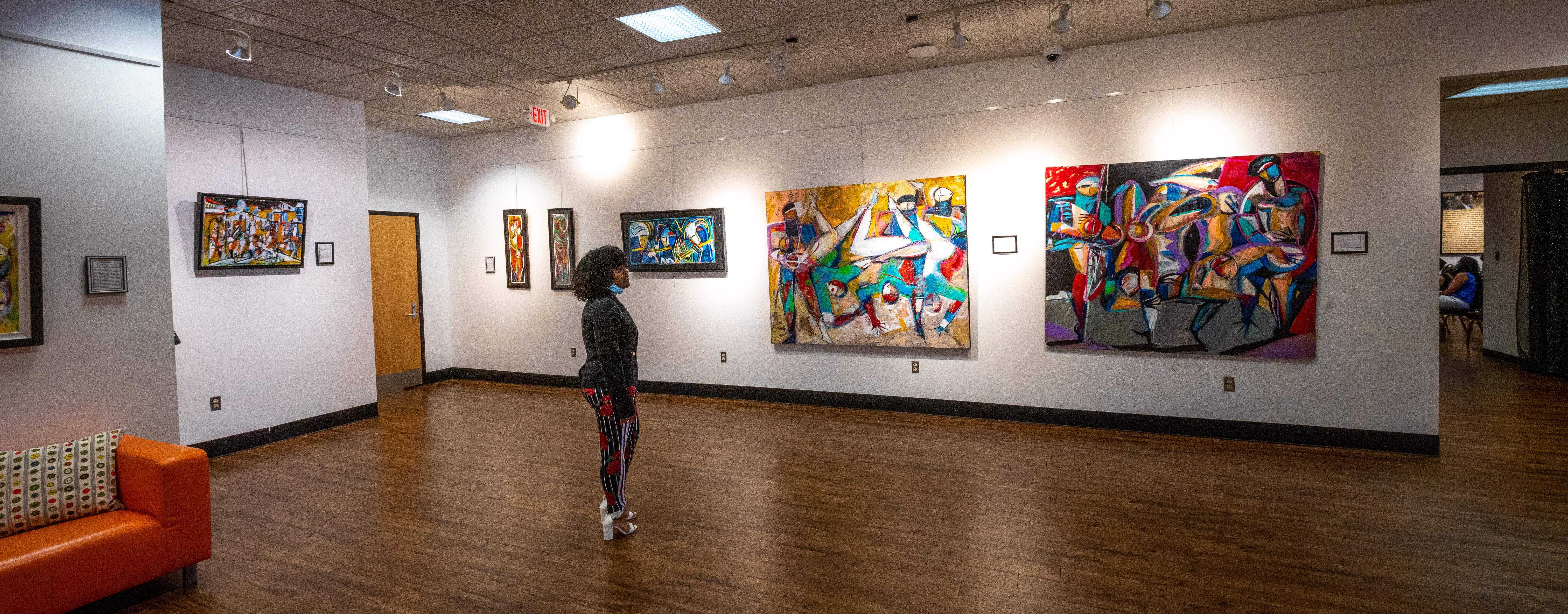 A person looks at artwork inside The Pearse African American Museum on Long Island