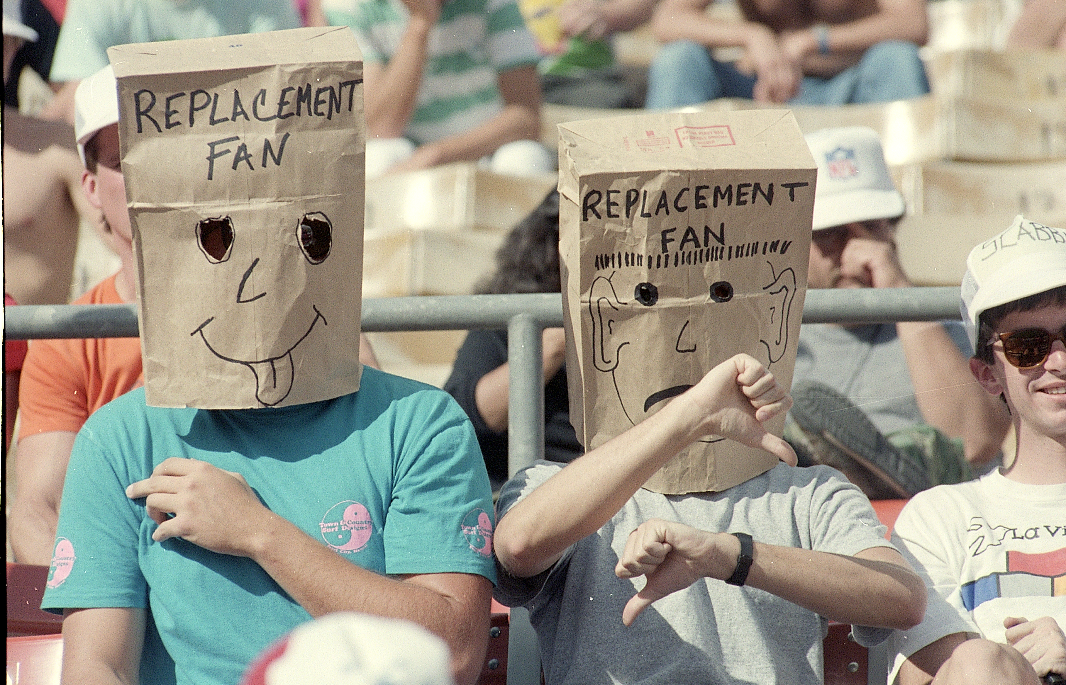 Fans Wear Paper Bag During Football Game