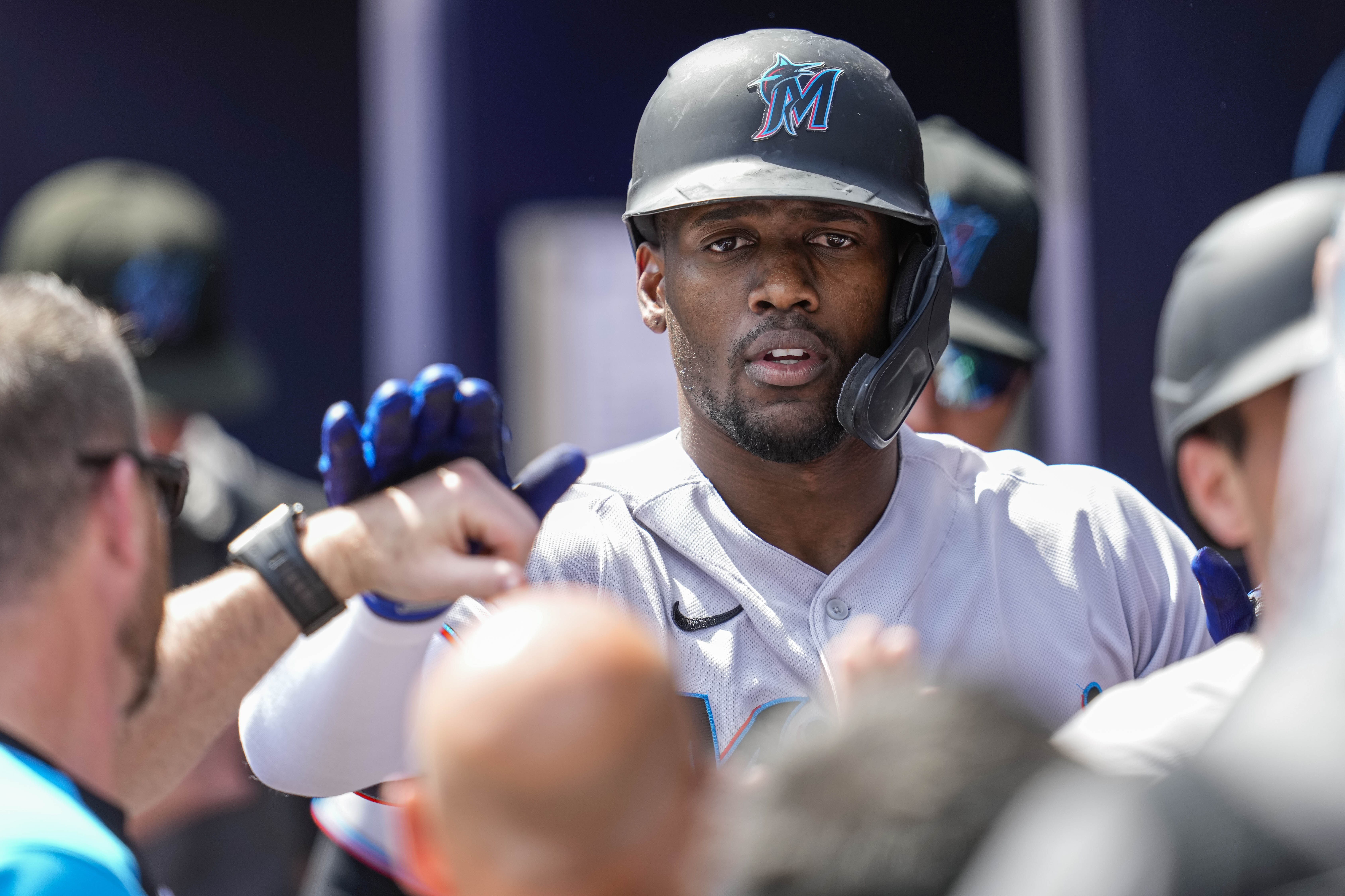 Miami Marlins designated hitter Jorge Soler (12) reacts in the dugout after hitting a two run home run against the Atlanta Braves during the seventh inning at Truist Park.