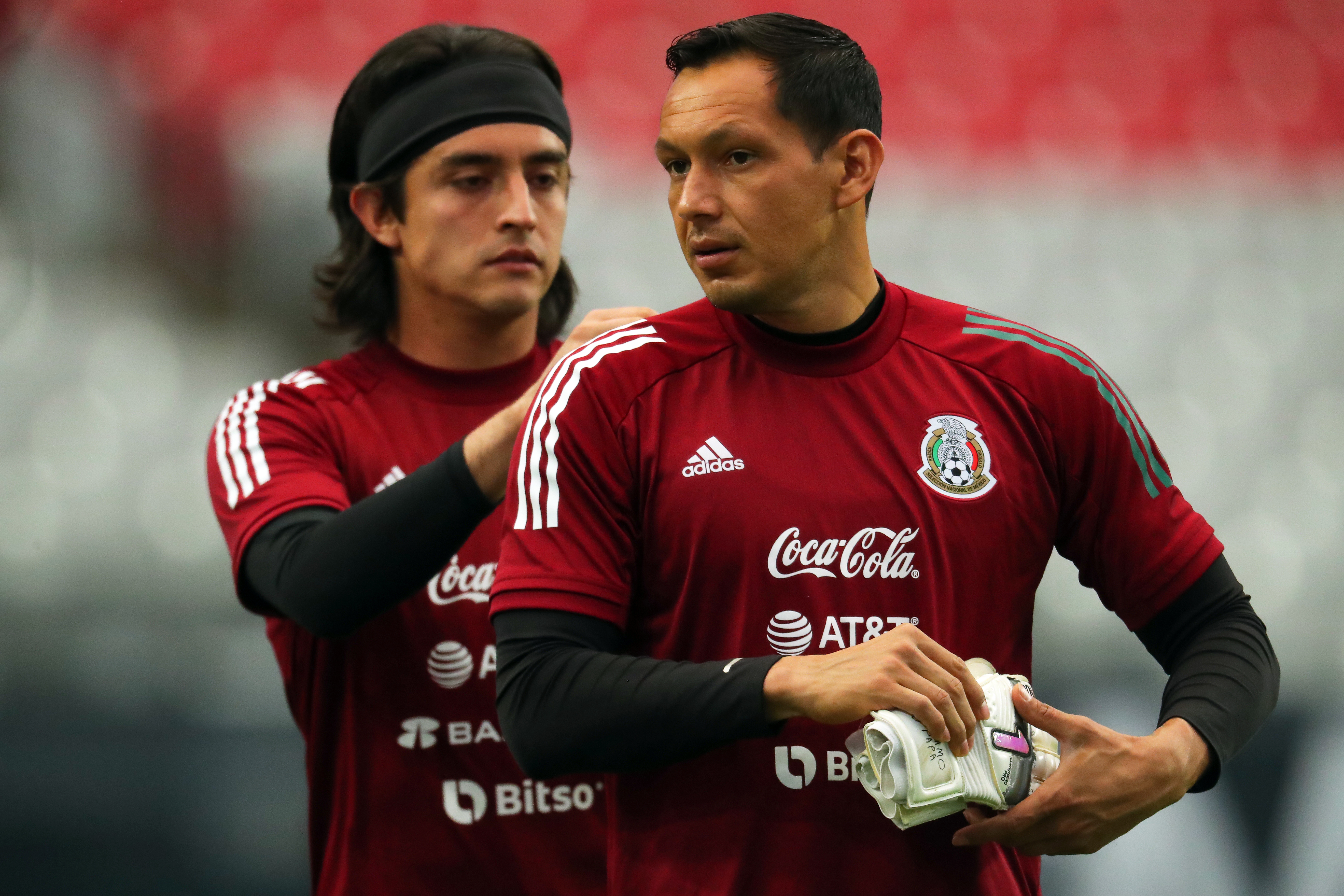 Goalkeeper Carlos Acevedo (L) of Mexico helps teammate Rodolfo Cota (R) during a training session ahead of a match between Mexico and Uruguay at State Farm Stadium on June 1, 2022 in Glendale, Arizona.