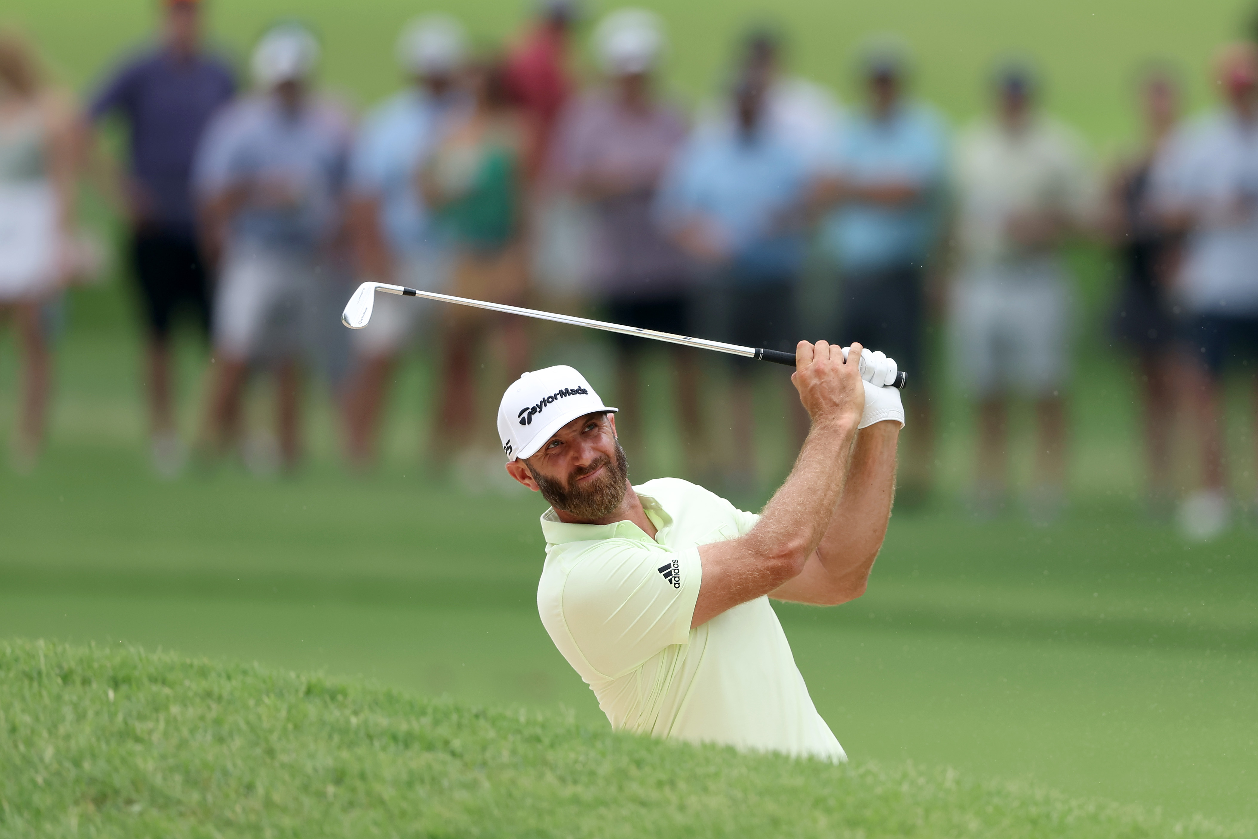 Dustin Johnson of the United States plays a shot from a bunker on the ninth hole during the second round of the 2022 PGA Championship at Southern Hills Country Club on May 20, 2022 in Tulsa, Oklahoma.