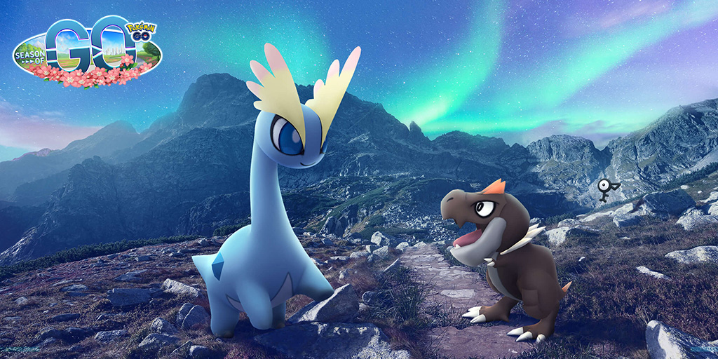 Tyrunt and Amaura on a mountain with an Unown F in the background