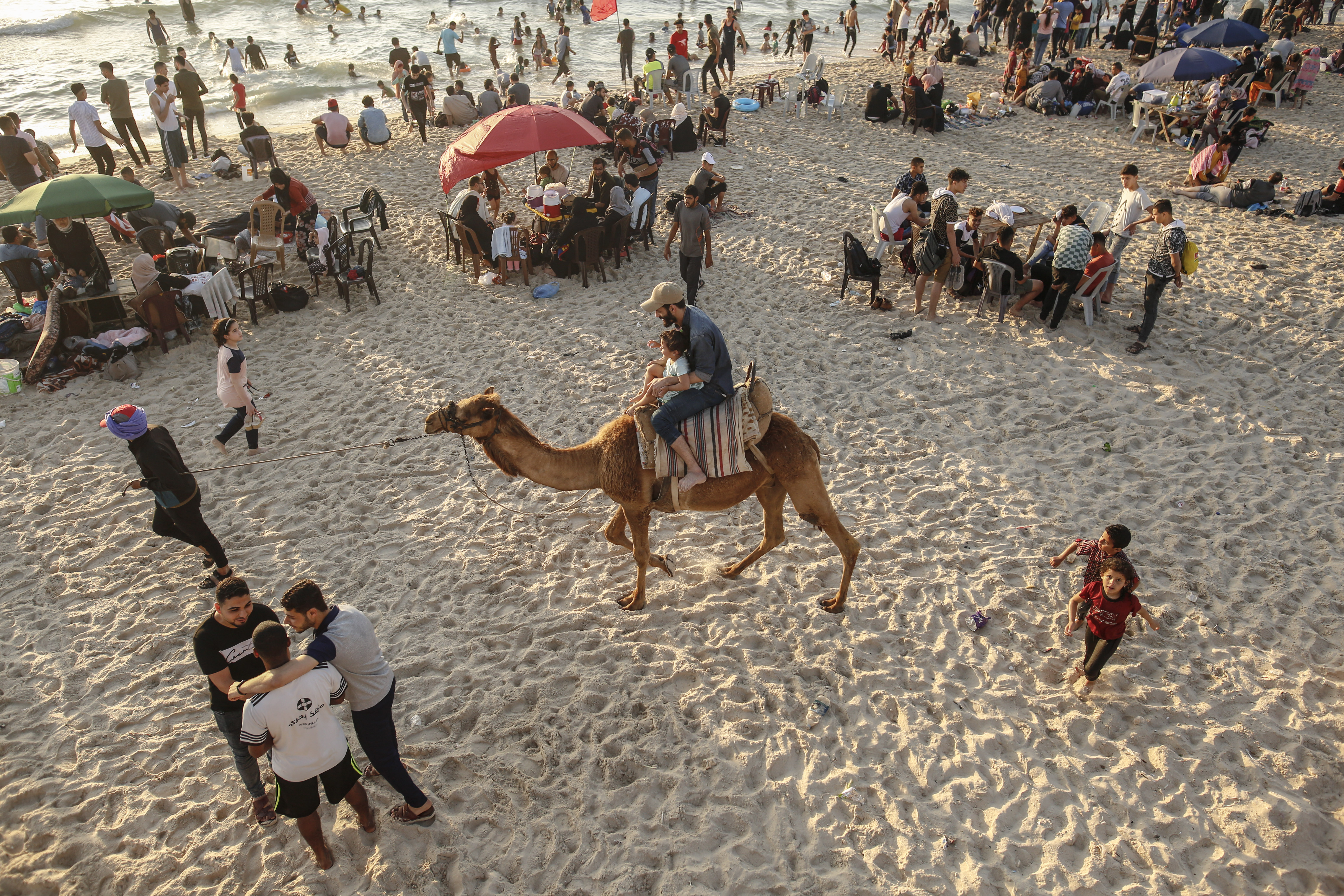 Hundreds Gather In Gaza Beach During Sunset