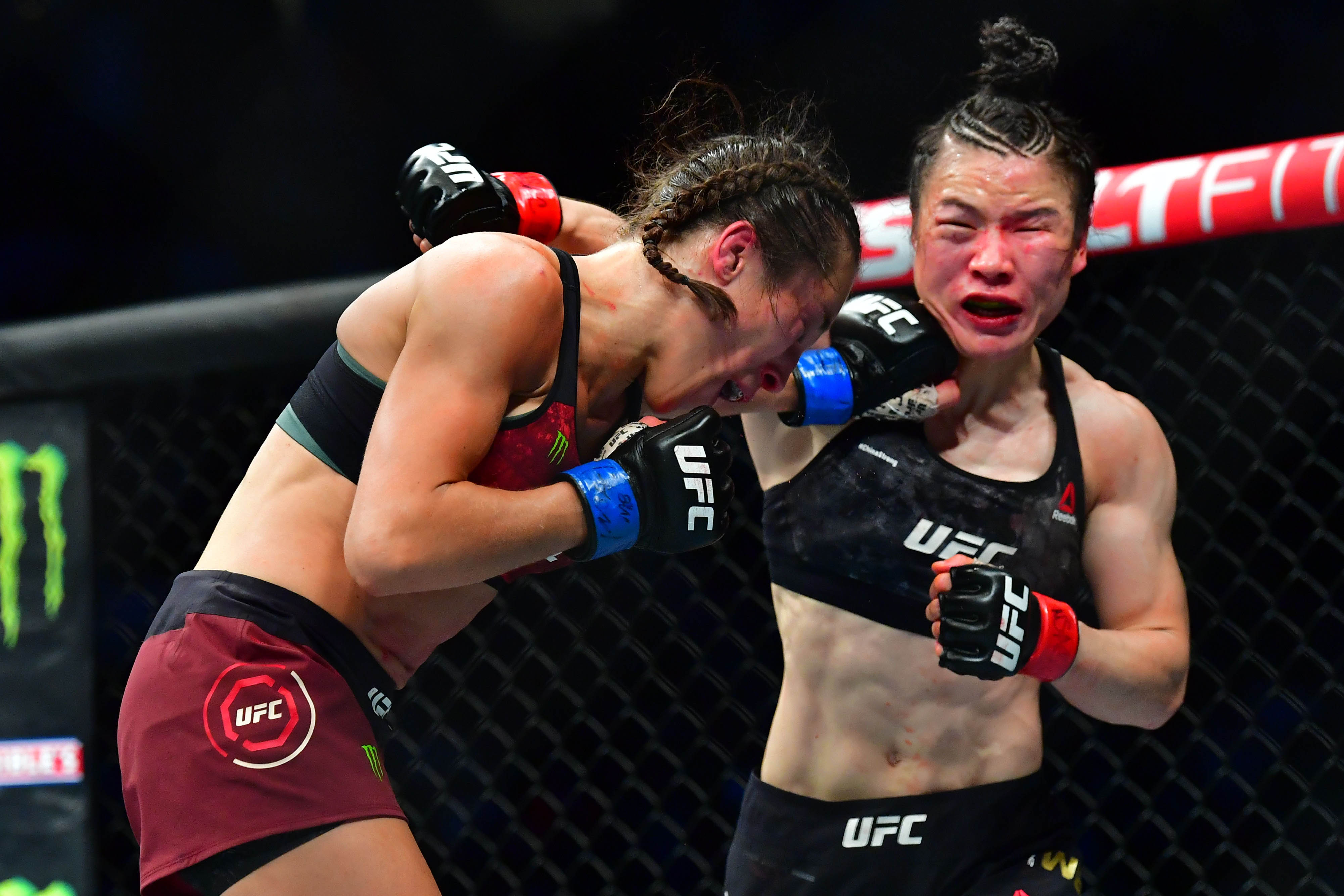 Weili Zhang (red gloves) fights Joanna Jedrzejczyk (blue gloves) during UFC 248 at T-Mobile Arena.