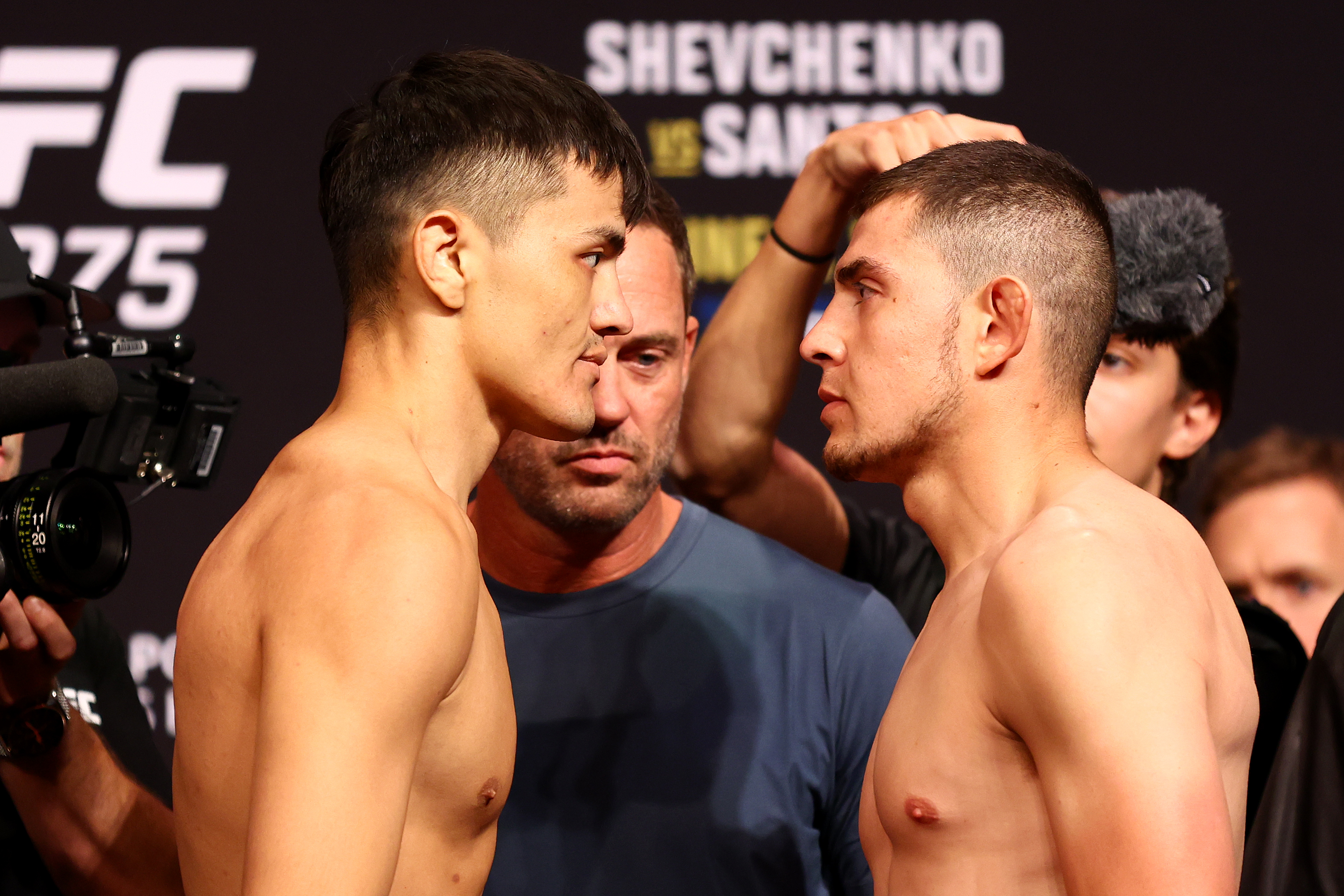Hayisaer Maheshate of China and Steve Garcia of the United States face off ahead of their lightweight bout during the UFC 275 Weigh-in at Singapore Indoor Stadium on June 10, 2022 in Singapore.