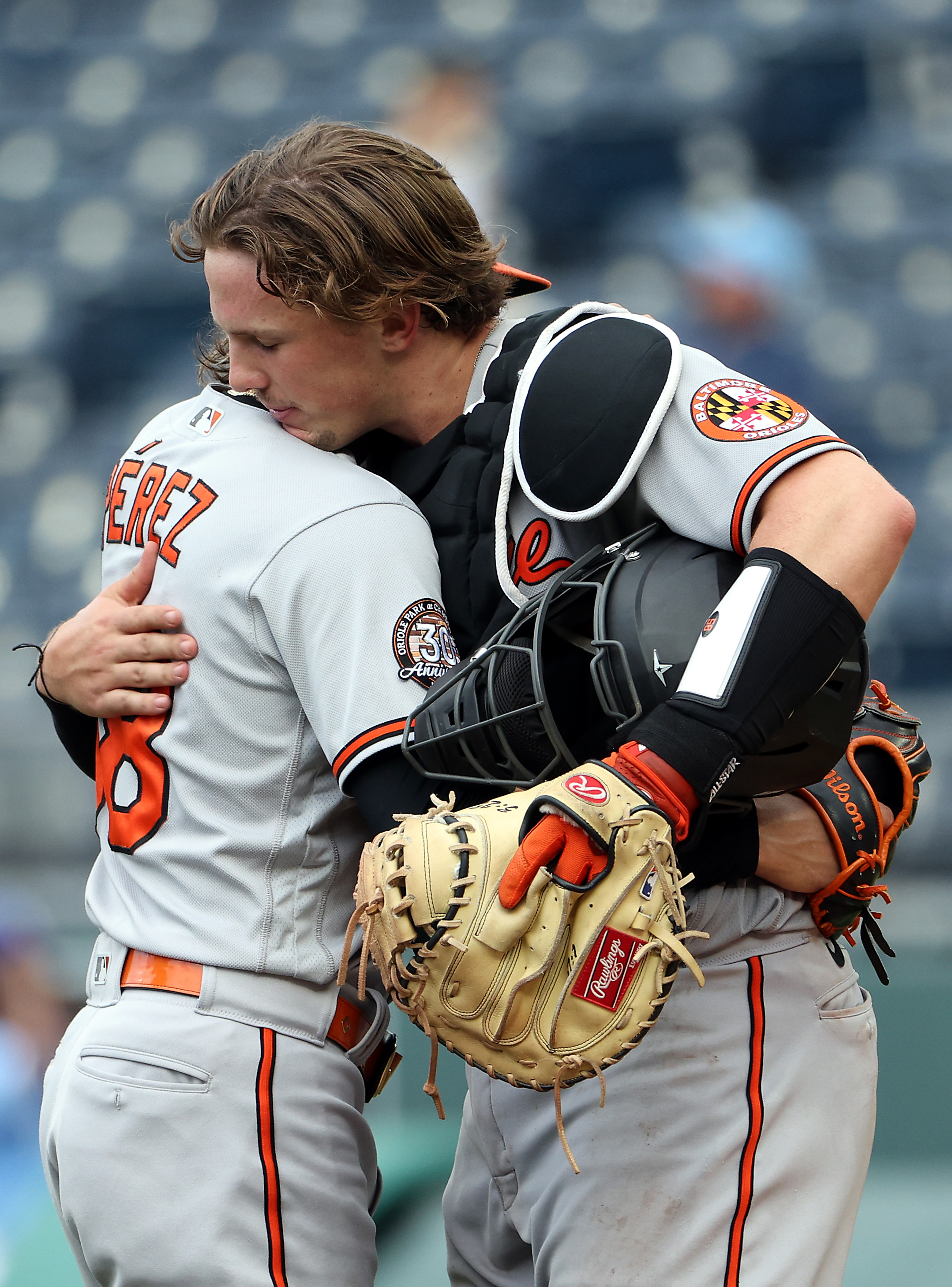 Adley Rutschman and Cionel Perez celebrate the win over the royals with a hug