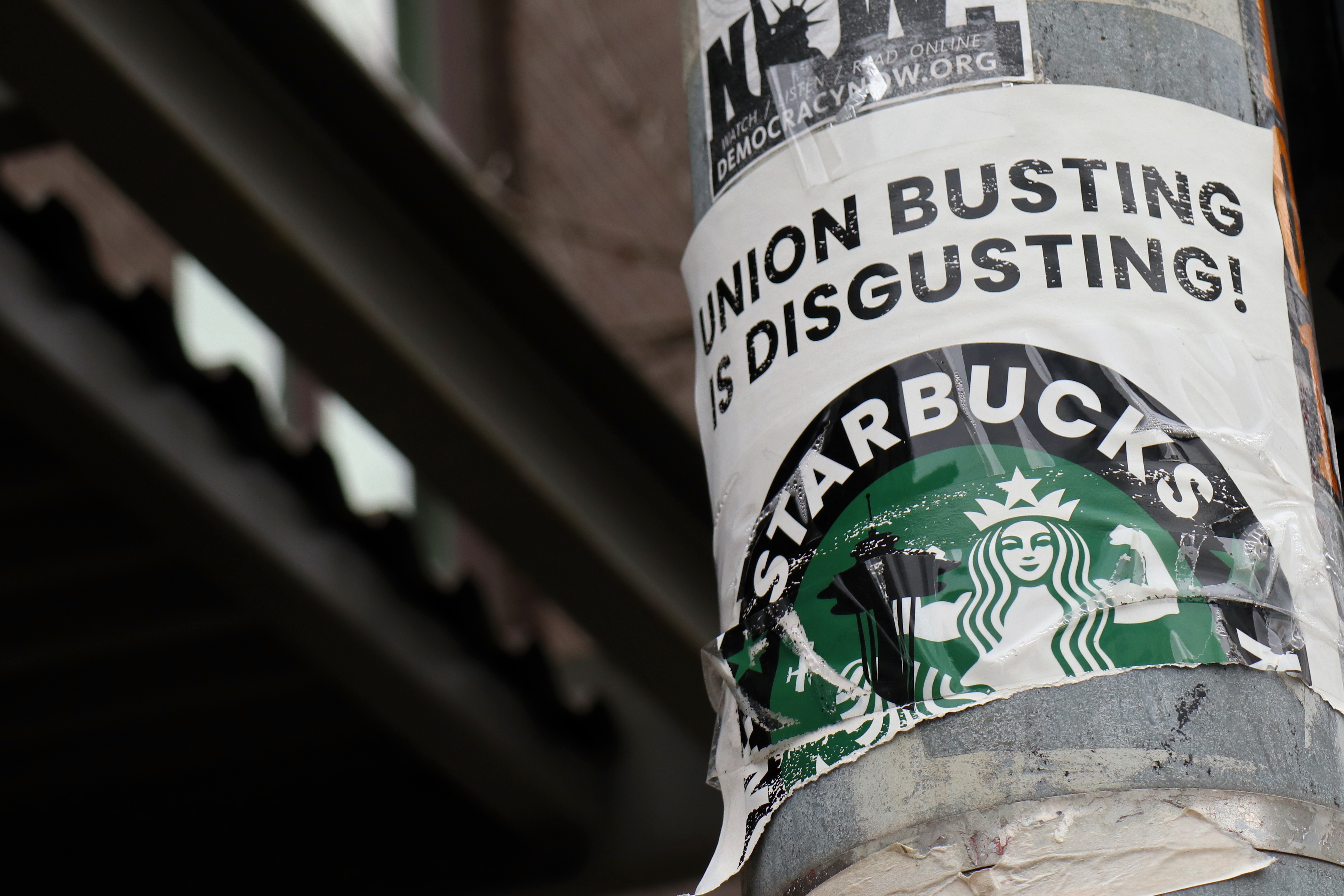 A pro-union poster is seen on a lamp pole outside Starbucks...