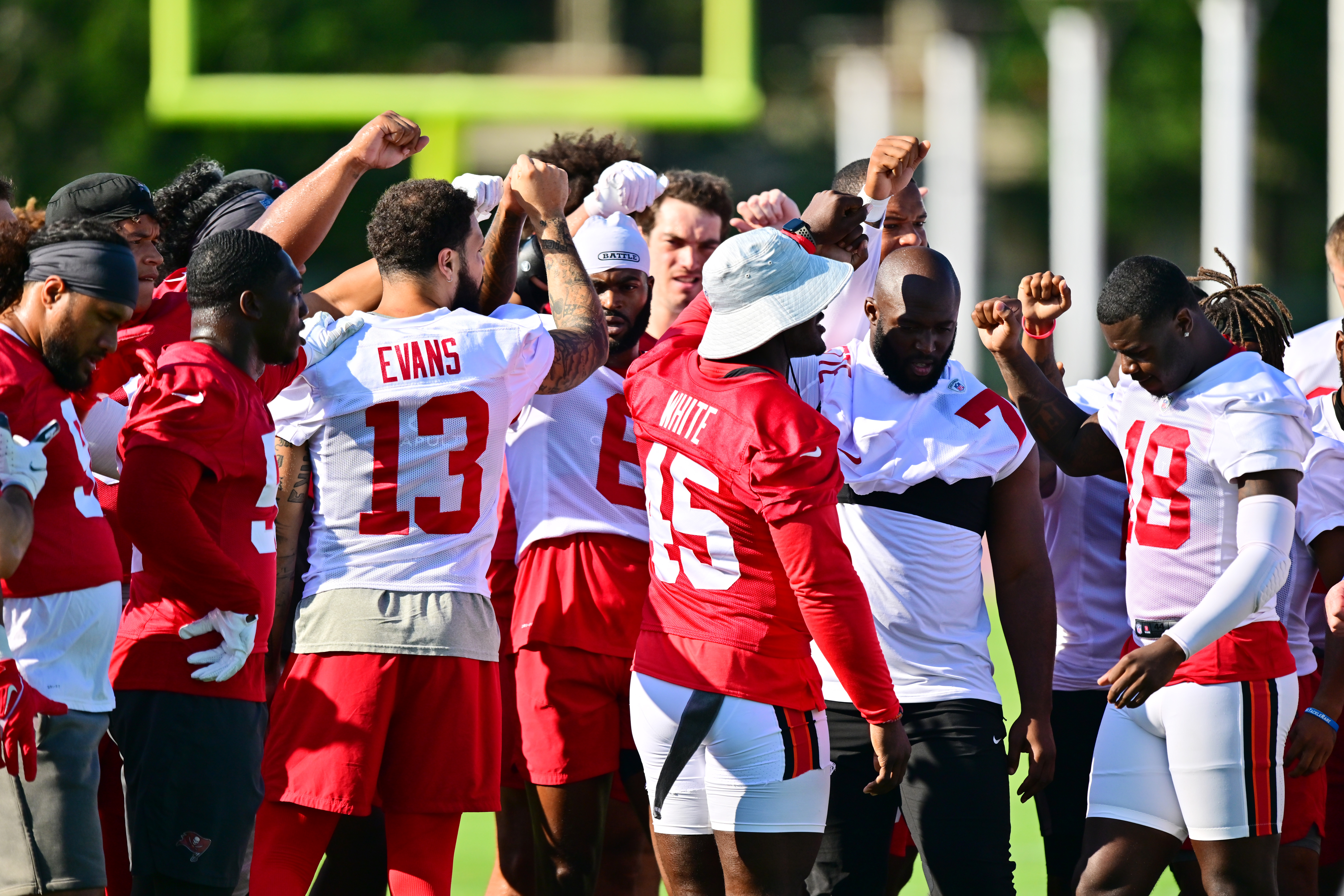 Tampa Bay Buccaneers players huddle during the 2022 Buccaneers minicamp at AdventHealth Training Center on June 08, 2022 in Tampa, Florida.