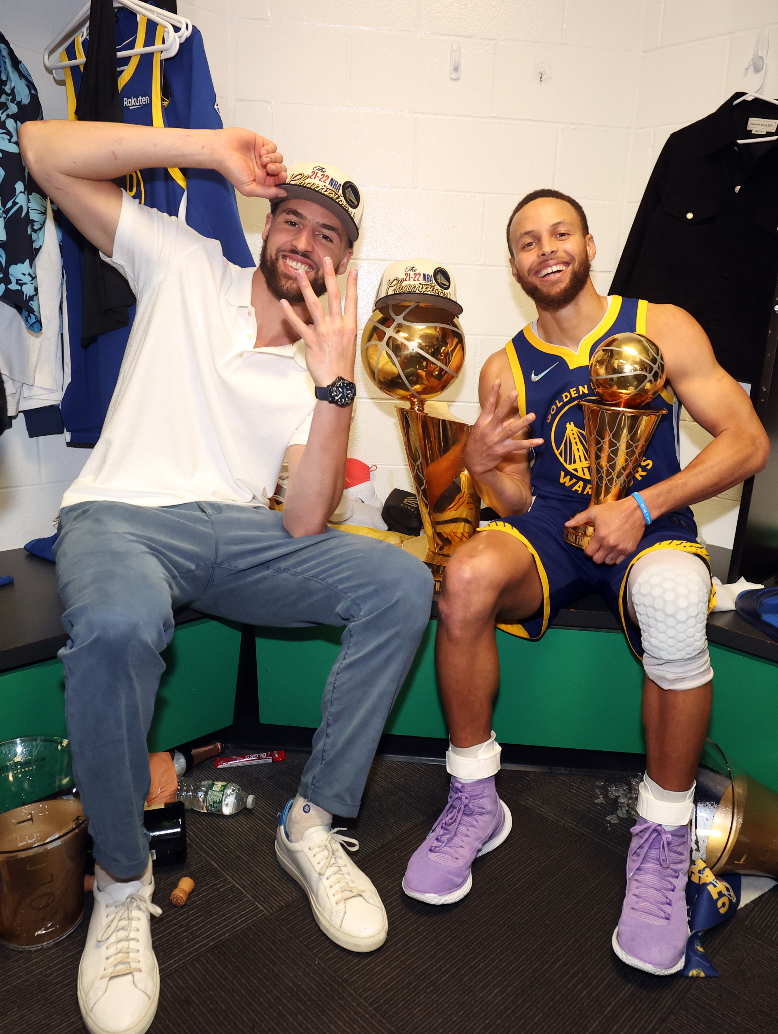 Steph Curry and Klay Thompson celebrating in the locker room