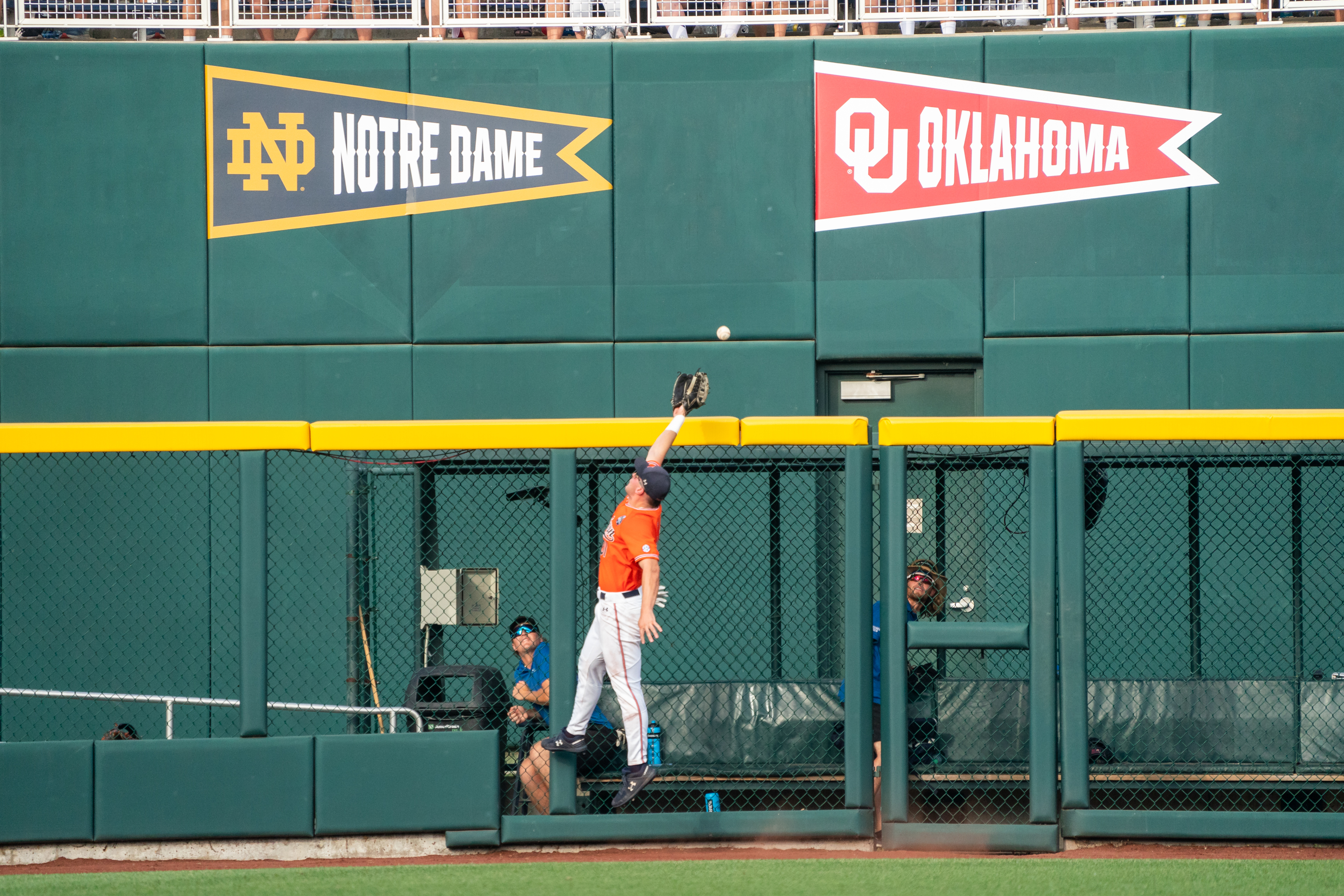 Auburn Tigers left fielder Mike Bello (31) reaches out to catch a home run hit by Ole Miss Rebels left fielder Kevin Graham (35) during the third inning at Charles Schwab Field.