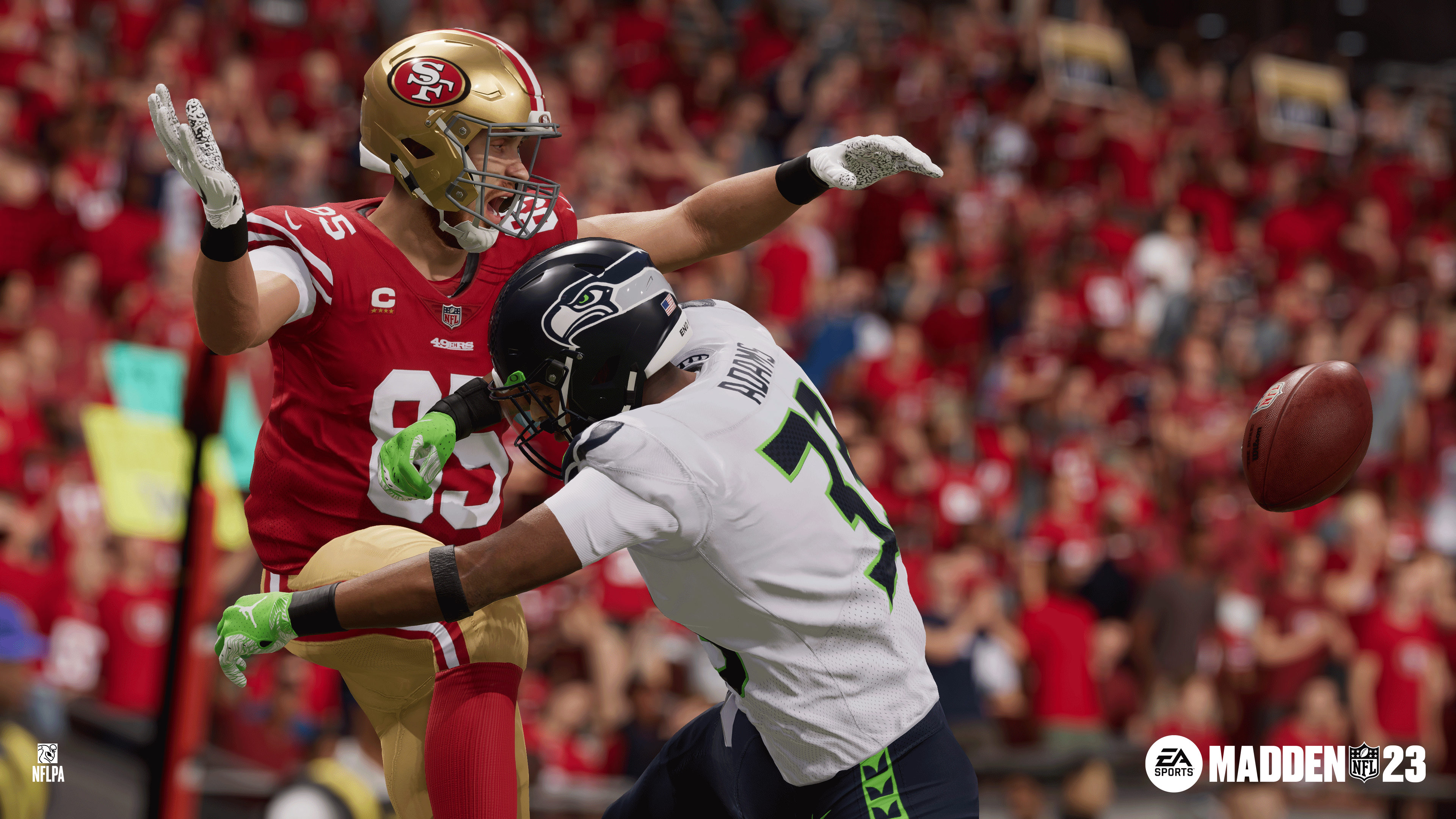 San Francisco tight end George Kittle is hit by Seattle defensive back Jamal Adams, knocking the ball free (at right) in Madden NFL 23