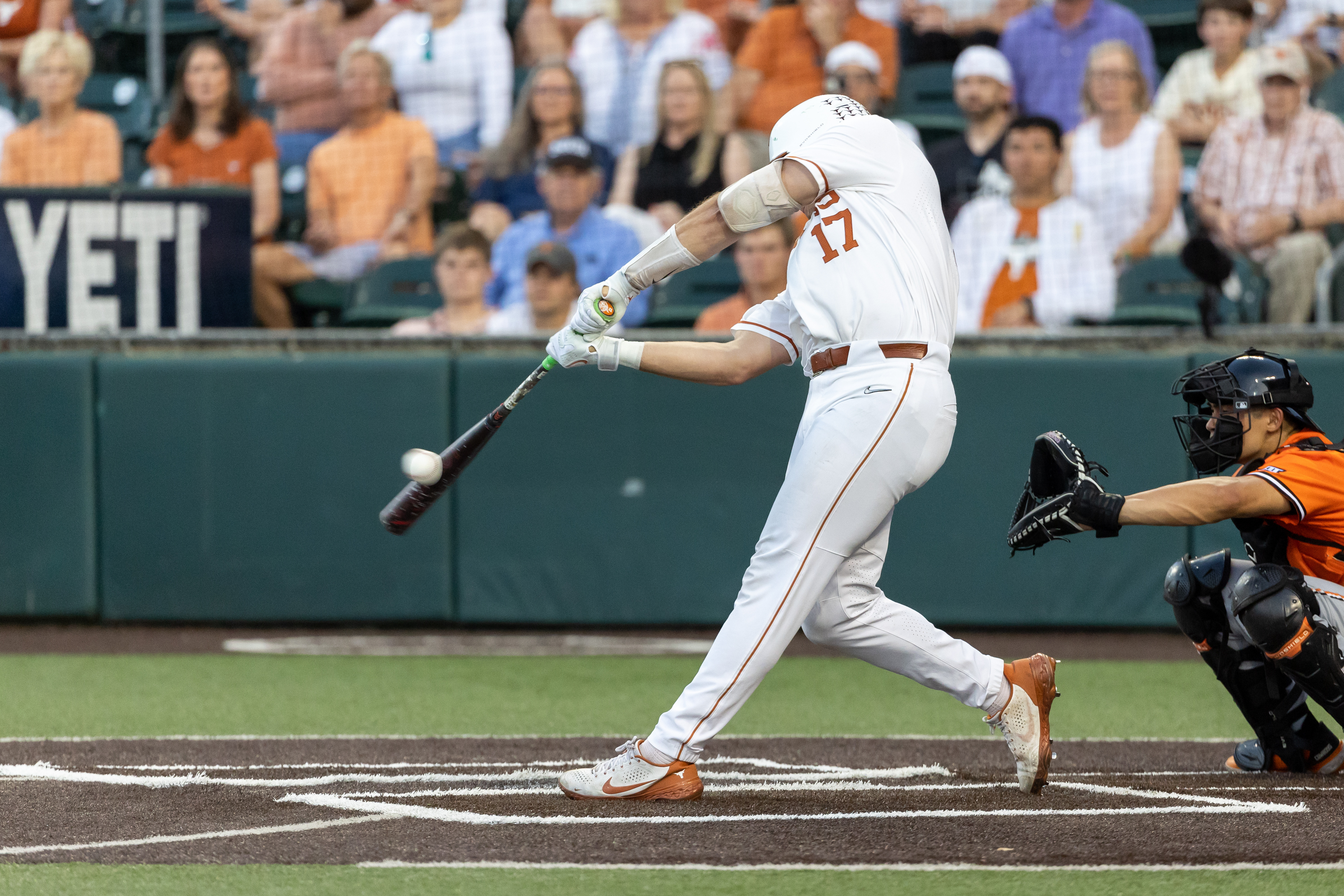 Texas Longhorns infielder Ivan Melendez (17) hits the ball during the game between Texas Longhorns and Oklahoma State Cowboys on April 29, 2022, at UFCU Disch-Falk Field in Austin, TX.